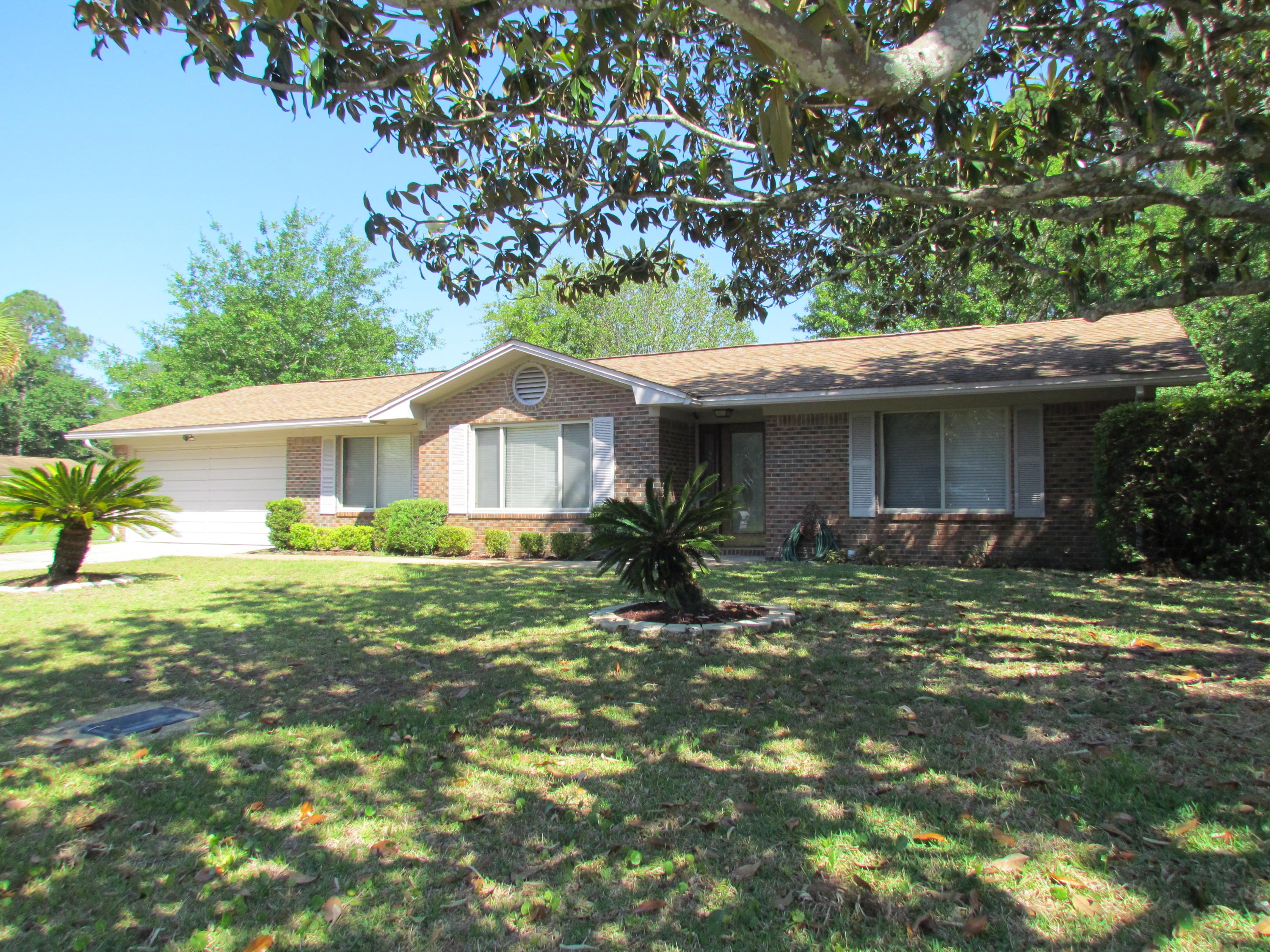 Beautifully updated, spacious home on cul-de-sac. Home has custom paint, crown molding, baseboards, granite countertops and stainless steel appliances. Living area has dark wood-grain tile and large attached Florida room (heated and cooled). There is a workshop in fenced yard and additional parking for RV or boat. Close to Eglin AFB and Destin Beaches! This home is a must see and won't last long at this price!