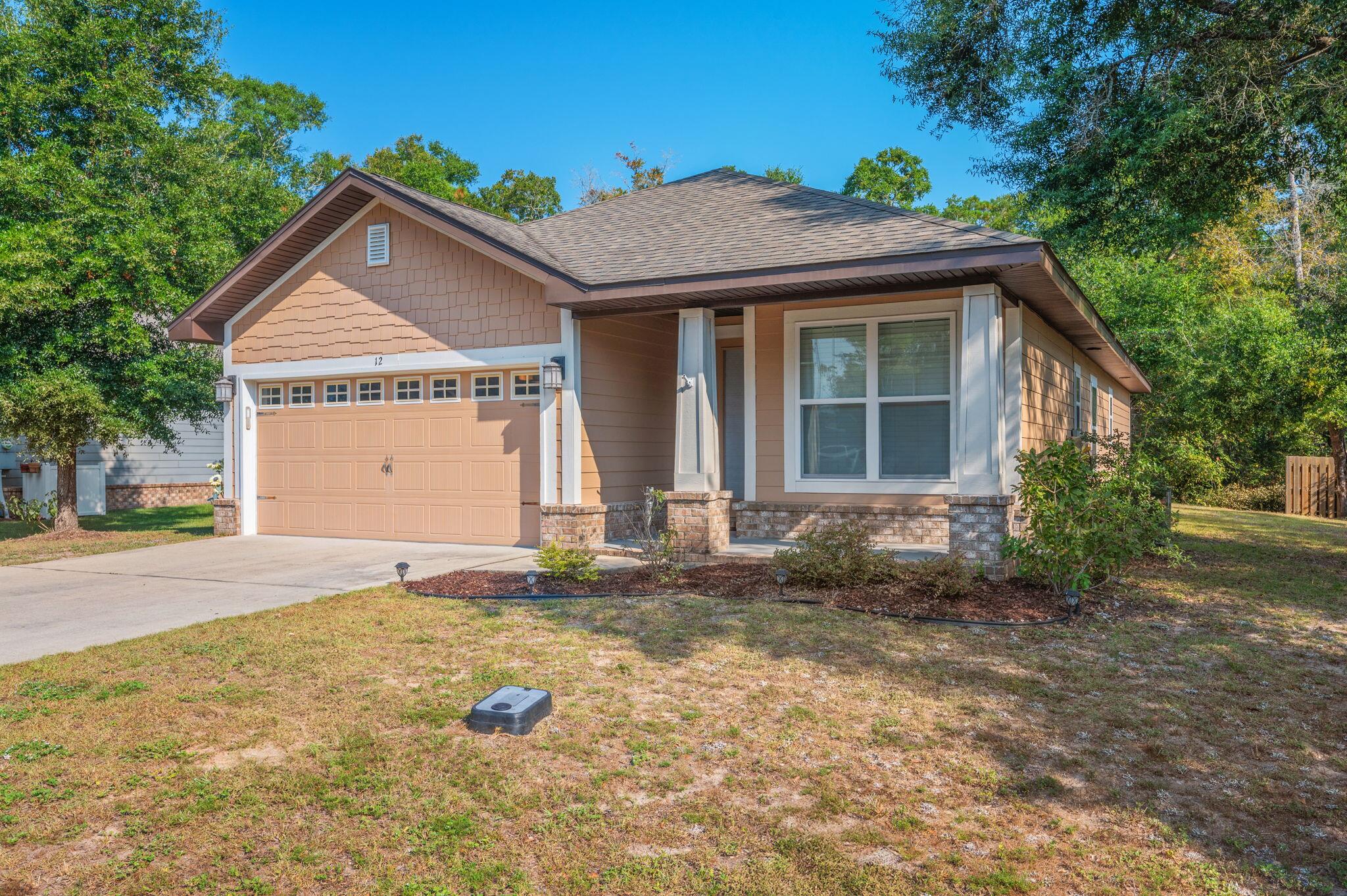 Welcome to 12 Benton Blvd, a charming 3-bedroom, 2-bath home situated on a desirable corner lot in one of Freeport's most inviting communities. This well-maintained residence offers an open and functional floor plan, perfect for both everyday living and entertaining. The spacious kitchen flows seamlessly into the dining and living areas, while the master suite provides a private retreat with its own ensuite bath. Enjoy outdoor living in the yard or take advantage of the community amenities, including a sparkling pool and playground, just a short walk away. Conveniently located near schools, shopping, and a quick drive to the beaches of South Walton, this home blends comfort, convenience, and community living.