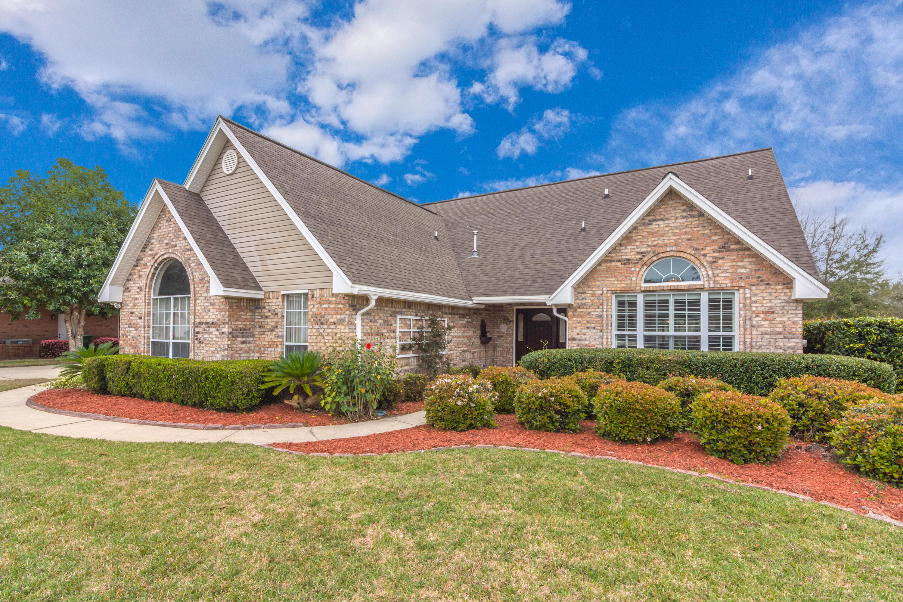 Welcome home to this beautifully updated, perfectly located, spacious and functional 5 bedroom golf course property! Tucked away in the secluded, gated Shalimar Pointe neighborhood, enjoy the country club lifestyle, excellent Shalimar schools, and extreme convenience to both Eglin and Hurlburt, beaches, shopping, and recreation. On the main floor, find a den that can flex to suit any need with pocket doors leading to a totally renovated gourmet kitchen with a full suite of high end stainless appliances, abundant cabinets and exotic granite counters. A generously proportioned dining area extends the kitchen space beyond the breakfast bar. Through a cased opening in the dining area is the great room flooded with natural light from a bank of windows two stories high. Off the great room...