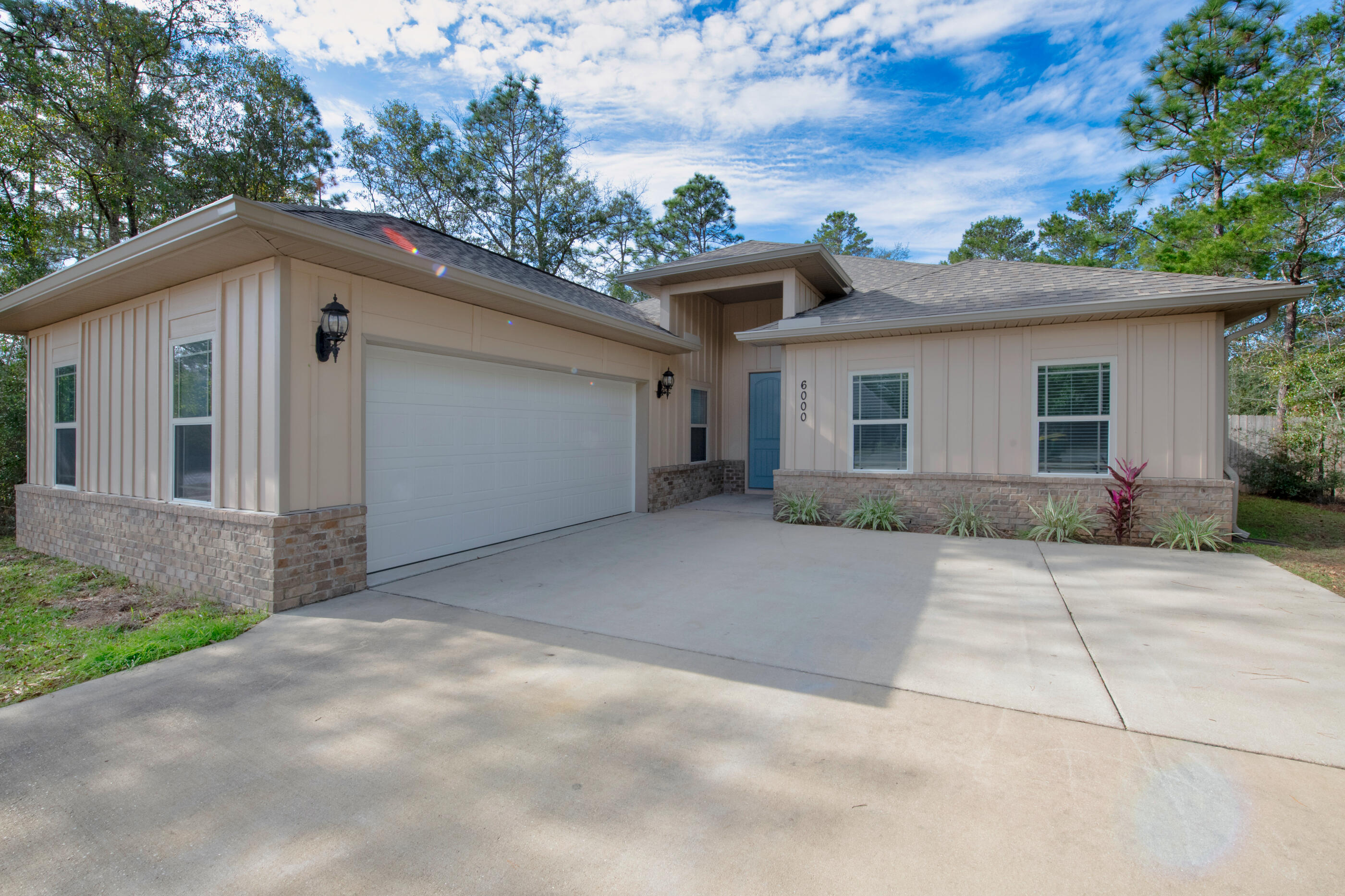 Welcome to 6000 Fiori Drive, a stunning 4-bedroom, 3-bathroom home nestled in the desirable Camellia Cove neighborhood in North Crestview. Built in 2017, this spacious property boasts just over 2,500 sq. ft. of modern living space and sits on a generous half-acre lot, offering plenty of room for outdoor activities and future landscaping projects.Step inside and be greeted by soaring ceilings that create an open and airy feel throughout the home. The heart of the house is a gourmet kitchen complete with granite countertops, sleek stainless steel appliances, and ample cabinetry for all your storage needs.The master suite is a true retreat, featuring a stylish tray ceiling and an elegant master bathroom with a double vanity, soaking tub, and a separate shower. The additional three bedrooms provide plenty of space for family, guests, or a home office.

Located just under 10 minutes from Crestview High School, this home offers easy access to excellent local amenities. For those commuting to Duke Field or Eglin Air Force Base, you'll enjoy quick drives of 25 minutes and 40 minutes, respectively.

Don't miss your opportunity to own this beautiful, move-in ready home in a fantastic location! Schedule a tour today!
