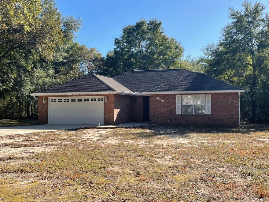 All brick home on 1 acre lot. Spacious split bedroom floor plan with larger than average rooms. Kitchen with ample counter tops and cabinets, pantry, and all appliances. Living area is open and airy with high ceilings and updated lighting. Covered back porch.