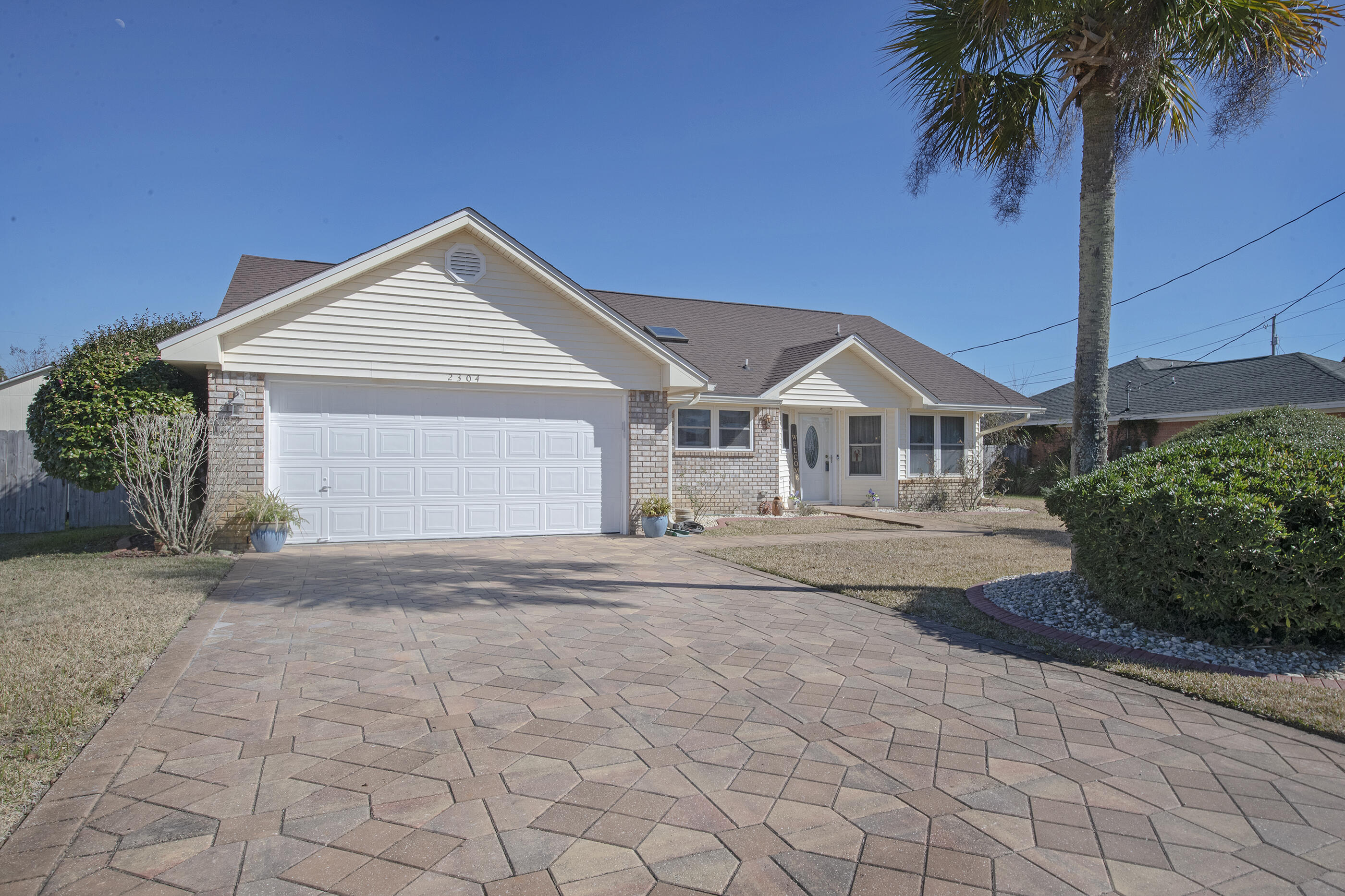 This move-in ready home is ready for new owners. As you drive up you are welcomed to a beautiful driveway with pavers and a well- manicured yard. Entering the front door is the dining room with lots of natural light and a large kitchen with a skylight, large island, granite counter tops, and stainless appliances to include a brand new microwave. A wood- burning fireplace welcomes you into a spacious living room. The master bedroom has plenty of room for all your furniture and the master bath has a large shower and double vanities. The split bedroom floor plan provides lots of privacy. The oversized Florida room is heated and cooled to be used year round and is a perfect place for entertaining. The Florida room leads to a fully screened patio and a large deck. The back yard is fenced in and has a storage/work shed. You can enjoy fresh fruit off your peach tree, guava tree and, a pear tree. The garage features a tesla charging station. The roof and water heater were replaced in 2019 and the a/c is 2007 and the heater and a/c unit in the Florida room was replaced in 2020. The ADT security system also conveys. The pool table is negotiable.