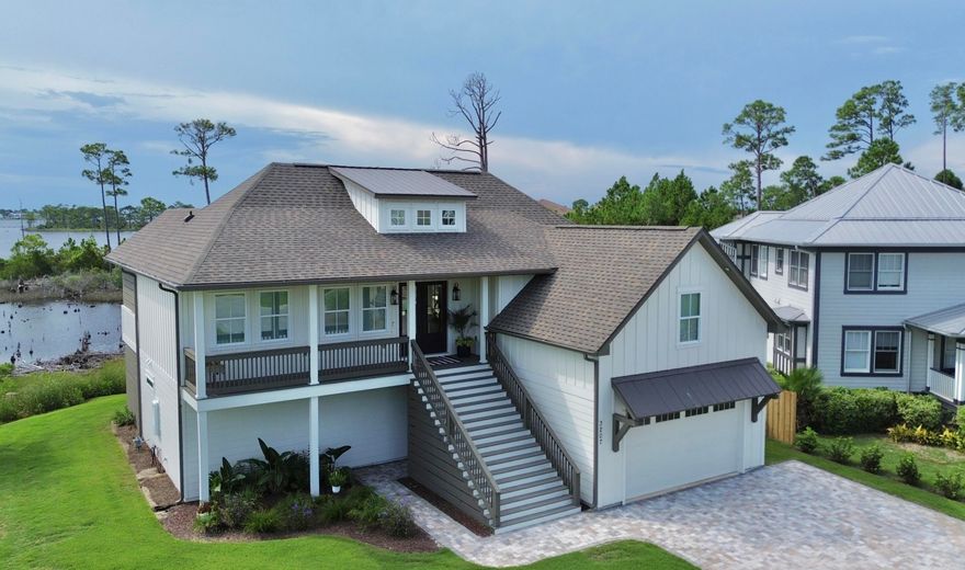 Welcome to WATERFRONT living in Bay Point--where thoughtful design meets sweeping views of Grand Lagoon. Built in 2023, this elevated coastal retreat offers a rare vantage point to watch the yachts glide toward the pass--all from the comfort of your expansive 52-foot back deck complete with an outdoor kitchen (grill, sear station, sink, storage) and sleek cable railing for an unobstructed view. Inside, oversized windows flood the main living space with natural light and showcase the water from nearly every angle. The kitchen is a showstopper with a 10-foot+ island, water-view sink framed by an eight foot wide window, and a butler's pantry that keeps the fridge, microwave, and coffee maker tucked away. No upper cabinets here--just clean lines and beautiful scenery. Upstairs is all all about entertaining, with the kitchen, living, and office oriented toward the water. One of the four bedrooms is currently styled as a game room/man cave with a large walk-in storage closet and direct access off the main living areaideal for flexible living. The office features 100+ year-old European doors that add charm and character. Downstairs, three bedrooms offer privacy and comfort, including a luxurious primary suite with water views, a spa-inspired bath with a soaking tub, walk-in shower, dual vanity, and an oversized custom closet. Just off the primary suite, step onto a private pavered porch with room for outdoor furniture and your very own eight-person Master Spas hot tuball with a peaceful water view. From the grand front staircase and double-door entry to the magical morning sunrises over the lagoon, this home was built for those who appreciate quality, comfort, and a view that never gets old.Home Ins. $2584. Flood Insurance (quoted) $2500. Ave Electric $200. Ave Gas $50. Ave Water $100