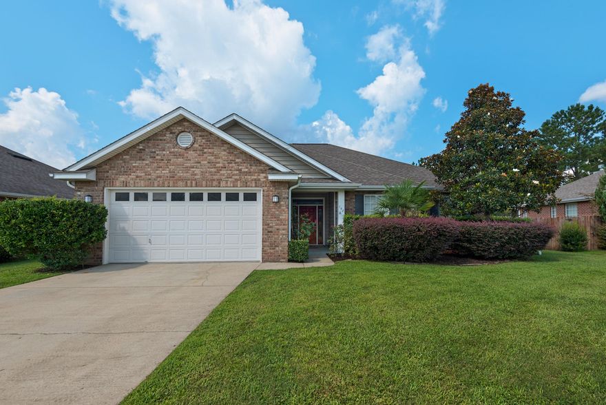 Welcome home!  This 4 bedroom, 2 full bathroom South Crestview home, built by Key Lime Construction, is one you do not want to miss!  This brick beauty sits on .28 acres and backs up to the woods.  The fully fenced backyard is huge, with plenty of room for a pool or shed.  You enter the home through the Foyer that flows into the large Great Room, with the fireplace, tray ceiling and French doors as the focal point.  The home boasts a well appointed Kitchen, with stainless steel appliances, gorgeous maple cabinetry, breakfast bar, solid surface counter tops, and a spacious pantry.  The Dining Room sits off of one side of the kitchen, while the Breakfast Nook and Laundry Room flank the opposite side.  The Master Bedroom is a retreat, with tray ceilings and its own entrance to the back porch,