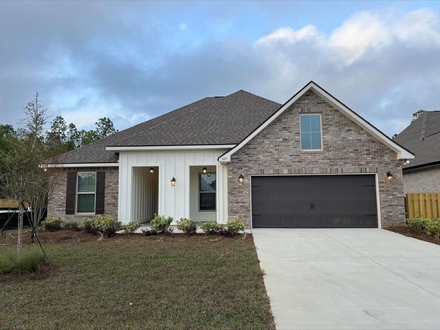 The HICKORY III G in Starburst at Hammock Bay community offers a 5BR, 3BA open design with formal dining room and separate den. Upgrades added (list attached).  Features: double vanity, garden tub, separate custom tiled shower, and walk-in closet in master bath, kitchen island, walk-in pantry, boot bench at garage entry, covered front and rear porch, crown molding, recessed lighting, framed mirrors in all baths, smart connect Wi-Fi thermostat, smoke and carbon monoxide detectors, landscaping package, architectural 30-year shingles, flood lights, and more!Energy Efficient Features: water heater, electric kitchen appliance package, vinyl low E windows, & more! Energy Star Partner.