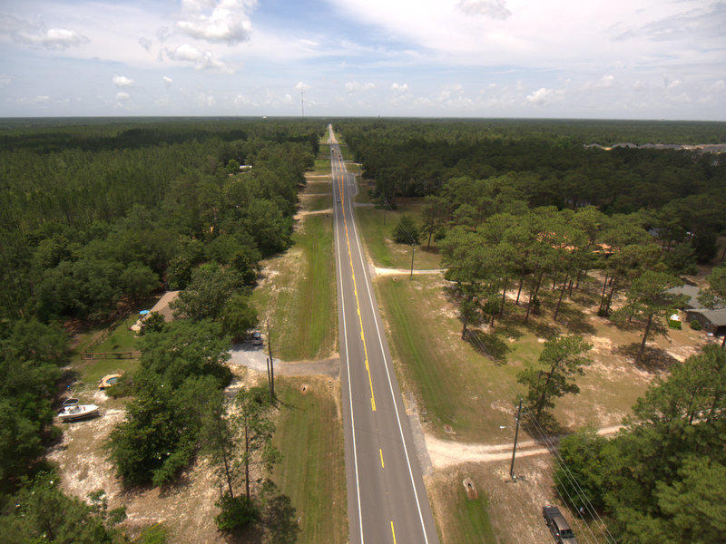 Zoned R-3. Residential development opportunity in Freeport. The sale of this property includes 2 parcels, for a total of 9.611 acres per property appraiser records (03-1S-19-23060-00A-0030 lot is included). Per Freeport Planning and Zoning, parcel is part of existing subdivision, with potential of being divided into 17 lots if road was put in. Purely administrative, would not need to be voted on. The R-3 allows for multi family housing, school, stadium, church, recreation center and much more. The owner has not done a timber cruise but it does appear to have some value in timber.