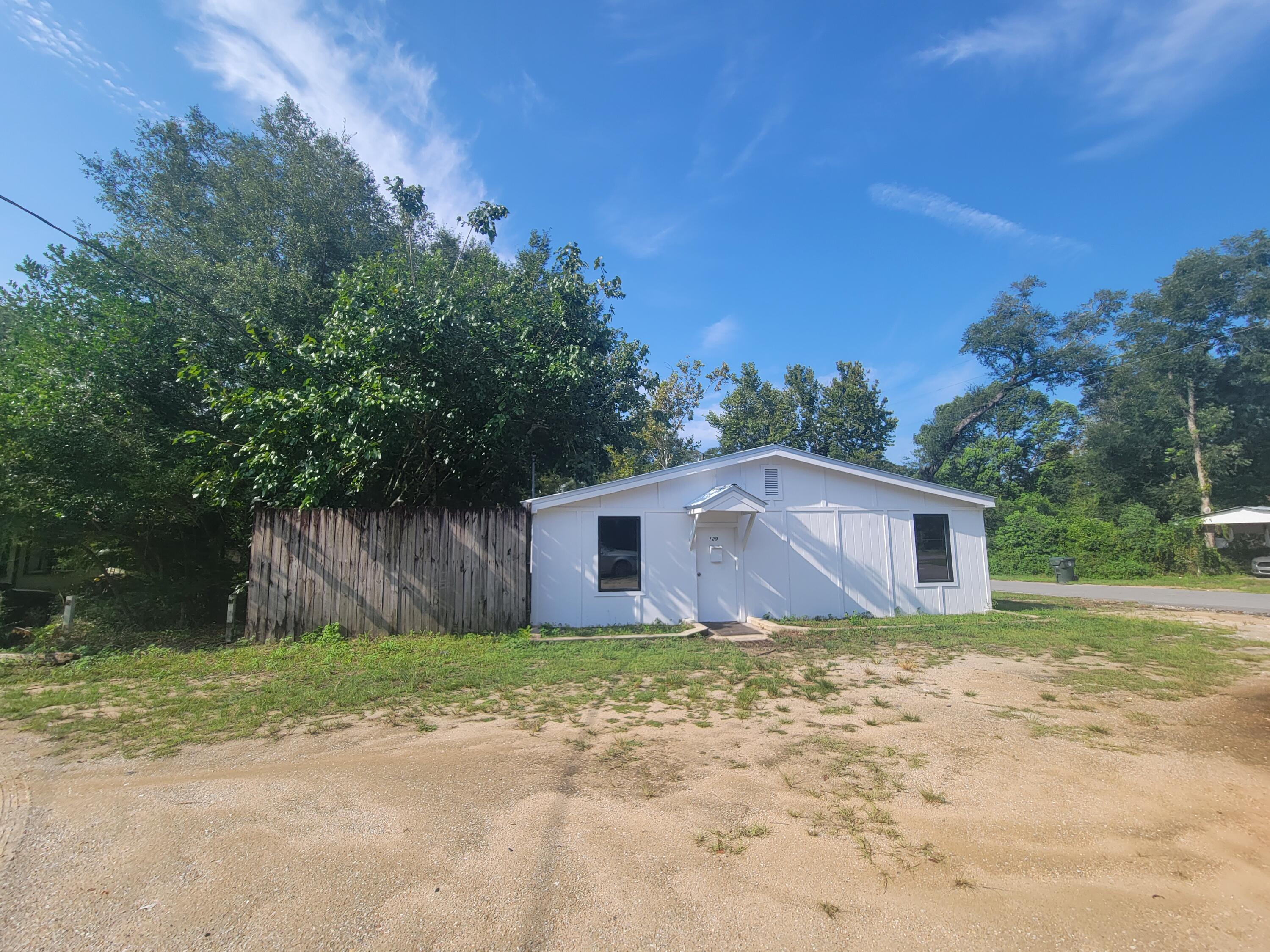 Motivated Seller- Bring CASH - contract for this 1700 s.f. Commercial (C-1) building just two blocks West of 331 S. Has new roof and recently repainted inside and outside. Has City water and sewer and electrical in place. The backyard has a 6' chain link fence and cement parking pad and 2nd utility pole with box was used to park an RV. There is nearly 1/2 acre (.46 acre) with this property. Only 6 blocks West of the Lake yard/Circle Drive....