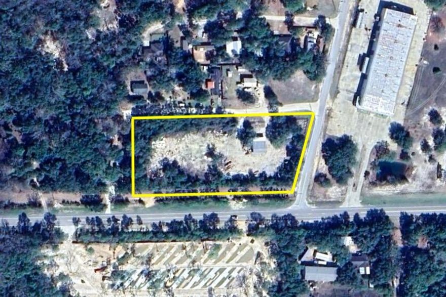 Available for purchase- 2.4 acres of Light Industrial Land directly on Hwy 20. This corner parcel is cleared with power and water pulled to a small job site mobile office as well as a workshop. No value is given to the any of the structures.