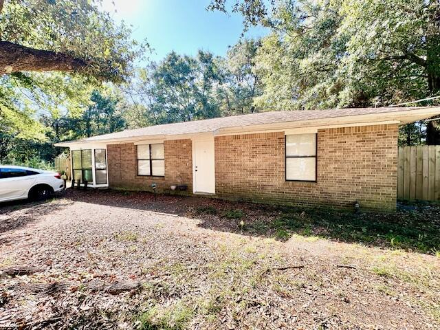 Owner needs 2-3 weeks notice for property to be move in ready, once applicant is approved. Flexible security deposit = to 1 months rent can be broken up in 2 monthly installments, if qualified. Pets allowed upon owners approval w/ a pet fee. This single-story, all-brick home boasts a spacious layout w/ a split bedroom plan maximizing privacy. The garage was converted into the master suite w/ a bay window & a large soaking tub. The home features ceramic tile & LVP flooring throughout, no carpet! The separate utility room adds convenience & the ceiling fans throughout ensures comfort all year round! The open back patio & large privacy fenced backyard provide ample space for outdoor enjoyment. This all-electric home is soon to be upgraded w/ a new fridge & range hood. Its location on John King Road & south of I-10 offers easy access to everything, both far & near. This home is a perfect blend of comfort, convenience & charm!