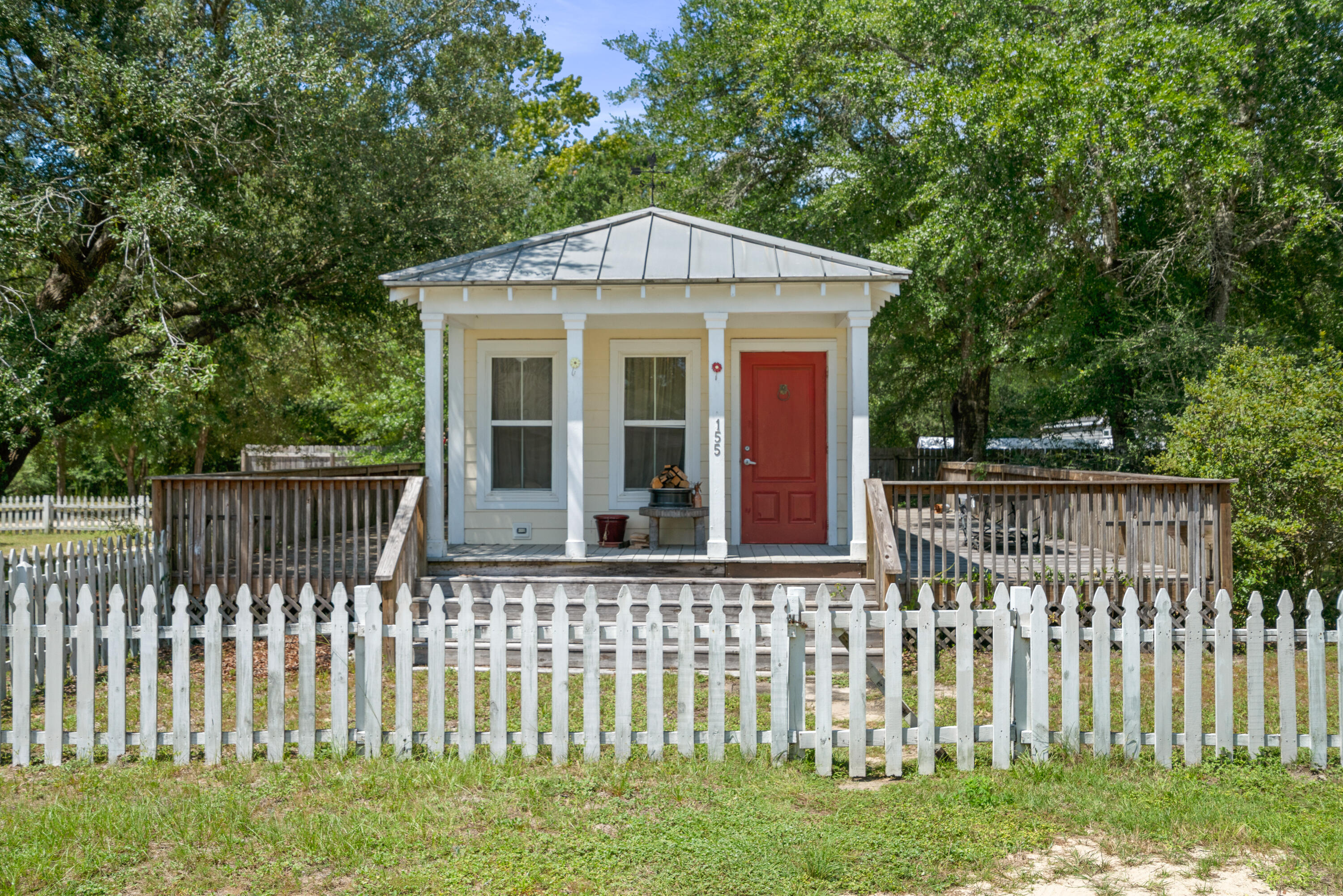 Income-producing Freeport cottages on four oak-shaded lots, just 15 minutes from the Emerald Coast's white sandy beaches! Built to withstand 165 mph winds, these charming homes feature metal roofs, Hardie board siding, double-pane windows, and energy-efficient insulation for low bills. Relax on multiple decks or porches, cook in kitchens with granite countertops and crown molding, and enjoy tile or laminate floors throughout. All tap fees are paid, and the lots allow room for two more additional homes. With established rental income and a prime location between Destin, Panama City Beach, and Fort Walton Beach, this property combines durability, charm, and endless income potential--perfect for investors or those dreaming of a coastal getaway lifestyle! This listing consists of a single parcel with four lots and two homes, with the total room count reflecting both properties. The seller is willing to consider selling each home individually: 155 Caswell Branch Road is listed at $210,000, and 161 Caswell Branch Road is listed at $195,000. Showings require a minimum of 24 hours' advanced notice due to tenant occupancy.