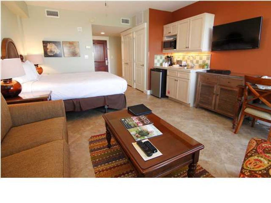 UPGRADED! Not your usual Studio Condo in the Village. 18'' diagonal tile, decorator furnishings, wall-mounted flat screen TV & a BAY VIEW. Compare to all others!! This condo was fully renovated midway through 2013 and still generated over $23k. It should do much better in 2014.($28k estimate from onsite rental company) The southern inspired design and architecture make this acclaimed landmark building the cornerstone for The Village of Baytowne Wharf. Adjacent to Sandestin's premier conference center, this studio rents well to vacationers and conference, event and wedding attendees. In addition to shopping, dining, concerts, and night life at the wharf, the resort boasts four championship Golf courses, a world class Tennis center, a full-service marina with boating, fishing, and