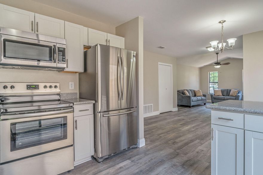 Renovated 2 Bed 2 Bath Home in Fort Walton Beach w/ fenced in yard and 1 car garage! The Kitchen has NEW White Shaker Cabinets, gorgeous Granite Counter-tops, and Stainless Steel Appliances. The Luxury Vinyl Plank Flooring in living and wet areas ensures low maintenance. New Bathroom Vanities, toilets, and Fixtures. Enjoy entertaining in the in yard! This home is Move In Ready fresh paint, new carpet, newer roof and much more! One car garage. Copper wiring. ! Great neighborhood. Schedule your tour today!