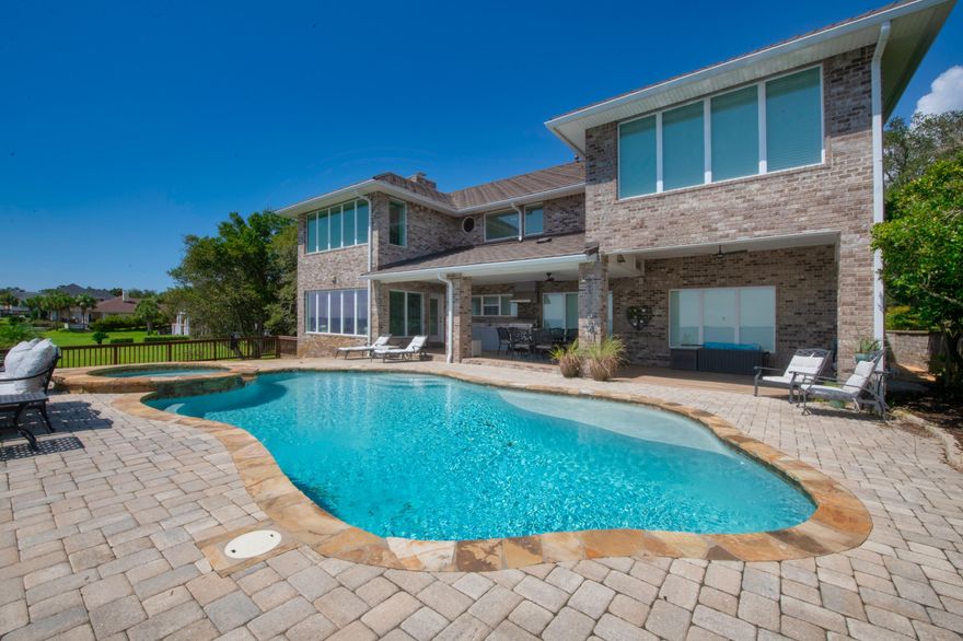 Is it your dream to live on the water?  Then this could be the home for you!  Situated on the Bluffs across the street from the 18th hole of Shalimar Pointe Golf Course, with possibly one of the best views on Choctawhatchee Bay. The home is gorgeous both inside and out.  The entry way opens to a large formal dining area with beautiful, panoramic views of Destin. There is a gourmet kitchen with a large breakfast bar and tons of cabinet space.  Relax and enjoy the views from every angle in the sunroom, or you can entertain guests in the spacious theater room.  There is one bedroom complete with its own bath on the main level as well as a half bath.  Upstairs you will find the huge Master Suite, complete with a massive walk-in closet, fireplace and sitting area that overlooks the water.  Two