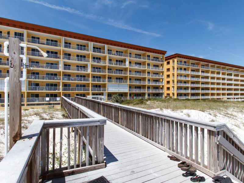 Price Reduced! Great end unit on 2nd floor, 1st floor is covered parking. This is a great 3 Bed/3 Bath unit with amazing views of the Gulf from the Living area, Kitchen and Master Bedroom. This is an end unit with no building next door to block your views. Just completed complete interior re-painting, new tile floors, new appliances and kitchen counter tops. Excellent rental potential or a great place to call home. Amenities include two pools, one heated, tennis courts, fitness room, 425 feet of beach & a picnic/BBQ area.