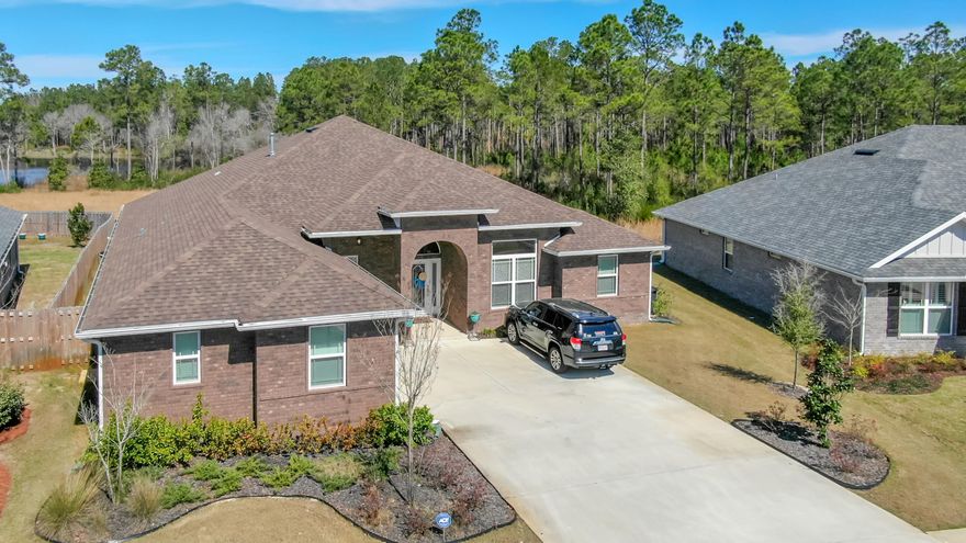 Such a beautiful, large, single level home located on a private preserve with serene water views - enjoy the tranquil setting from your screened in lanai. This home, built in 2017, boasts 4 bedrooms, 3 baths, an office with glass French doors, a formal dining room with 12 ft ceilings, plus an additional bonus room, and an open floor plan with plenty of entertaining space. The family room offers a spacious layout with 12 ft ceilings that extend into the kitchen. The kitchen contains granite countertops, white kitchen cabinets, a walk-in pantry, and a gas stove. This home has a tankless Rinnai water heater, hardwood floors, and a large 13' x 11' laundry room. Only 30 miles to Eglin AFB.