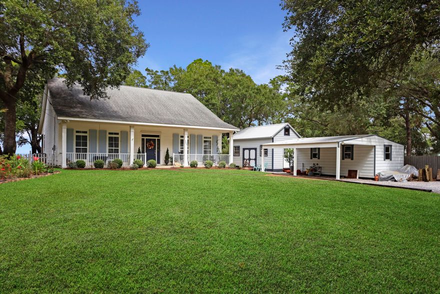 Open House Sunday 1-3 pm. Introducing Bay Haven Cottage, where New England charm meets Gulf Coast ease. Gated and set high on East Bay, this waterfront jewel enjoys about 100 feet of frontage and nightly sunsets from a 44 ft by 12 ft deep screened porch. Inside, real hardwood floors connect bright living and dining spaces with crown molding, recessed lighting, and volume ceilings. The bay-view kitchen offers island storage, bar seating, and under-cabinet lighting. The primary suite faces the water and tile-inlay shower. Outside, enjoy a 120-foot dock with stairs, 8,000-pound lift, seawall, and riprap. Practical perks include a 2014 roof, 2018 HVAC, irrigation, gated entry, two workshops with carport, and 0.71 acres. All minutes to beaches, shopping, Pensacola, and Destin.