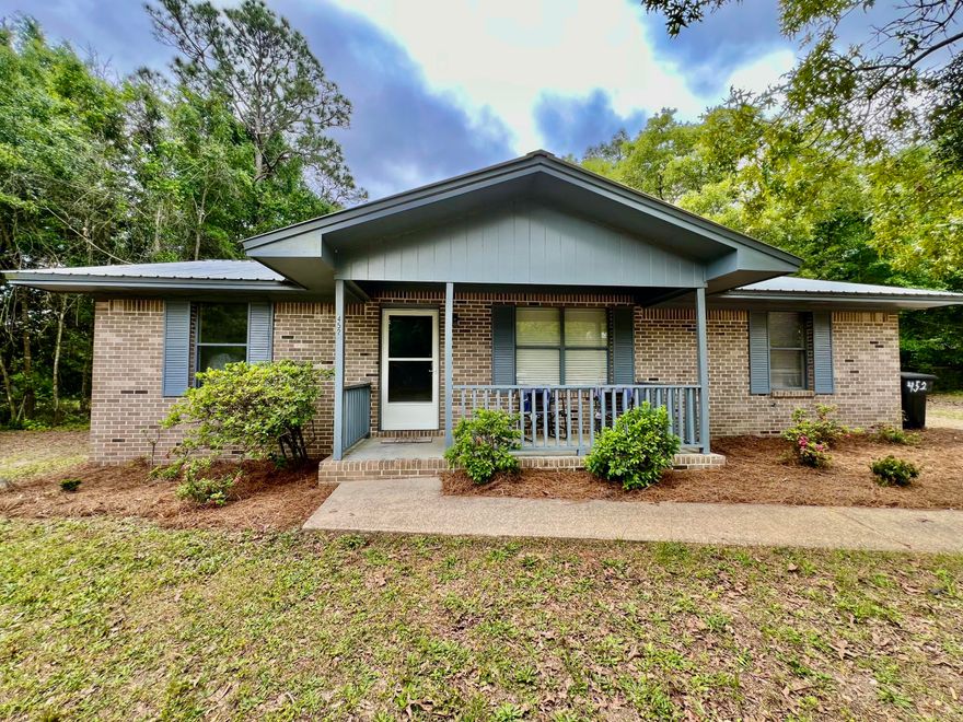 Welcome to your move in ready home.  Schedule your showing today.  Large family room open to the dining area.  Large master bedroom.  Spare bedrooms are a nice size as well.  This home sits on almost an acre of land with woods on both sides and the back of the property.  There is a metal storage building and a wood storage building on the property that convey.   Home is about 33 miles to Blue Mountain Beach with white sandy beaches on the gulf.  Home is just 5 miles to town.  New Vinyl Plank Flooring through out the home.  Interior has been freshly painted.  Kitchen has updated countertops, new appliances, and freshly painted.  Updated wiring.  All new light fixtures.  Water heater is new.  Buyer to verify all information and dimensions.