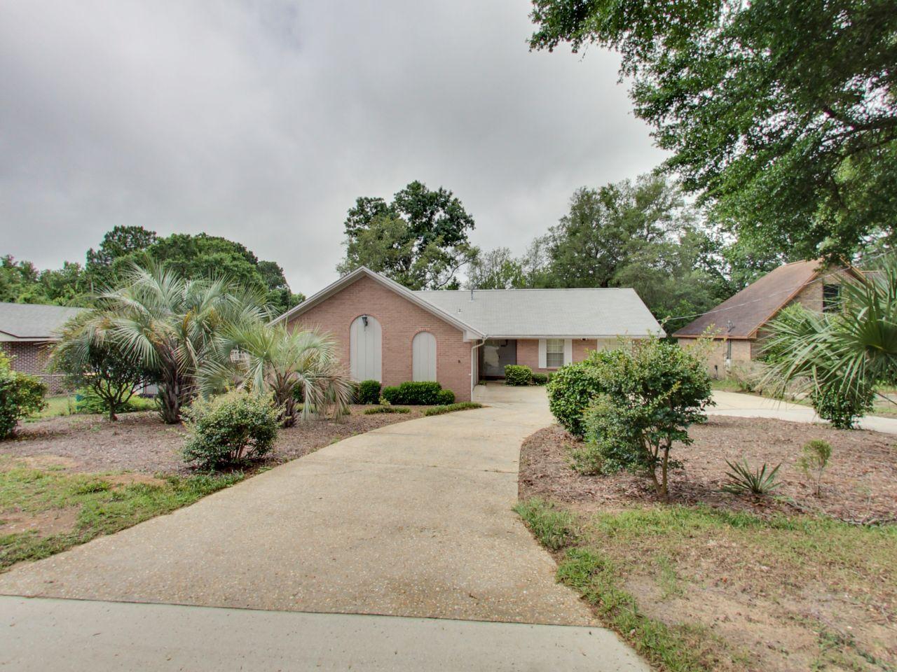 3 Bed 2 Bathroom home on a pond in the center of Niceville. This well kept home is inviting as you walk into the living room that boasts a wood burning fireplace. The kitchen is spacious with plenty of real wood cabinets, spacious countertops, and a breakfast bar. 10 X 13 Dining room. The master bedroom is 13x13 with a full master bath with a tile shower and tile flooring. The 2 guest bedrooms have carpet and ceiling fans in each room. The guest bathroom has a tile shower tub combo for the kids. On the back of the house there is a 12x20 screened in patio overlooking the spacious yard and large pond. 2 car garage, Located close to Eglin AFB, and the top rated schools in the area. Duke field is roughly 20 minutes north and the Okaloosa State College is less than 5 miles away.