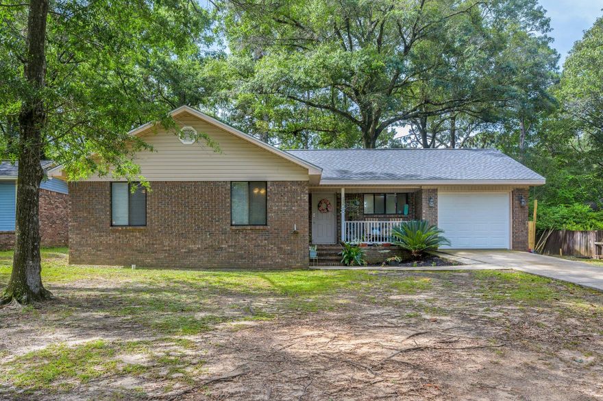 **Key Updates: Roof 2022, HVAC 2022, Water Heater 2022** This well kept, all brick home is convenient to Bob Sikes Elementary School and minutes away from the newest Publix shopping center! The good sized living room is accented by a beamed cathedral ceiling and brick fireplace. LVP floors complete this welcoming space, extending down the hall and into the master bedroom (home is carpet free!). No popcorn ceilings here--walls and ceilings are accented with spanish lace texture. Kitchen features ample cabinet/counter space, along with a dedicated eat-in dining space. Appliances are all updated, including a gas stove--a rare find in Crestview!  Enjoy your Florida evenings in this privacy fenced backyard, complete with a large covered deck and mature oak trees.