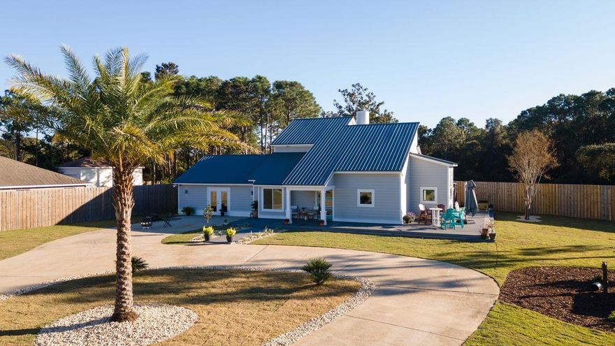 Ideally located overlooking the Emerald Bay Golf Course between the Gulf and the Choctowhatchee Bay, this home is perfect as a second home or primary residence with no flood insurance required and no HOA fees! Offering plenty of parking space, the security of a fully fenced lot with an automatic private gate, and great location just minutes from the community boat ramp, this home is a boater's dream. The 1.1-acre lot also boasts an RV pad with electric hookups and a detached mother-in-law suite with kitchenette. The fully renovated main residence features a new metal roof, new HVAC, new flooring, a custom maple & walnut staircase, new high-end lighting and plumbing fixtures, wrap-around deck and balcony overlooking the beautiful Emerald Bay golf course, a spacious screened porch, and more!