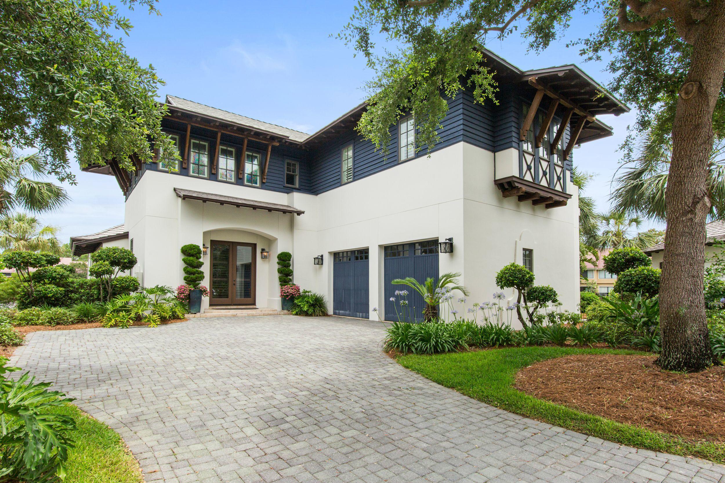 Back on market, no fault of seller. Located in the lovely Island Estates community, this four bedroom, four bath home is offered furnished with high end Maitland-Smith furnishings.  The waterfront home overlooks the lake and is just minutes from the gulf.  The large, open kitchen includes a sub-zero refrigerator, Wolfe stove, and Bosch dishwasher.  The downstairs features a separate breakfast room and dining room as well as the open living room.  The master bedroom is downstairs with an additional office that could also be a bedroom. The upstairs includes two bedrooms with full baths and a balcony overlooking the beautiful lake fountains. The outside porch offers a beautiful veranda leading to private pool. The home has a new roof, updated HVAC and water heaters.