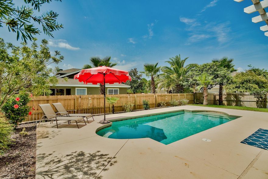 Are you looking for your perfect home to beat the heat? Check out this beautiful 4 bedroom / 2 & 1/2 bath Contemporary on a corner lot! This home has a large open floor plan with a great room featuring high ceilings throughout. The open kitchen features Milano Cabinets, granite counter tops, Whirlpool stainless steel double oven, built-in microwave, & refrigerator. The kitchen and dining room also open into the living room, perfect for entertaining. The master bedroom adorns French doors leading out to the patio & in-ground pool. Back inside the bedroom there are 2 spacious closets with built in shelving, making organization easy. Master bath features an over sized soaking tub, separate spacious shower, & double vanities. The upstairs loft has a built-in bench, cabinets & bookshelves made