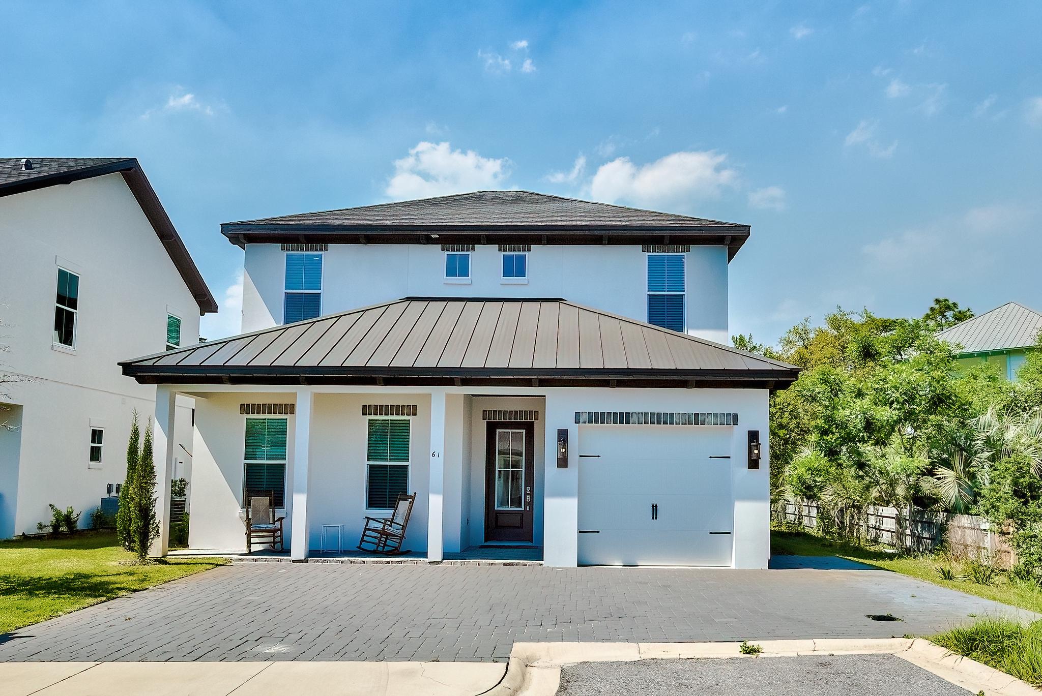 *INVESTORS - Since introducing the home to the rental market in May, it has produced over $48,000 on the books for 2021. A local management company currently manages 3 other homes on the street and is providing projections exceeding $90,000 annually with proven booking history.* Talk about a perfect location! Welcome to ''Carefree Cottage'' This house has it all, walking distance to the beach, but also tucked away for those looking for some privacy. The home has TWO master bedrooms, one on each floor, two guest bedrooms and a loft space upstairs to finish out the cozy sleeping arrangements. Cedar wood beams and shiplap compliment the gorgeous kitchen, dining, and living area completed with new designer furnishings. Once you open the sliding glass doors and step out onto the