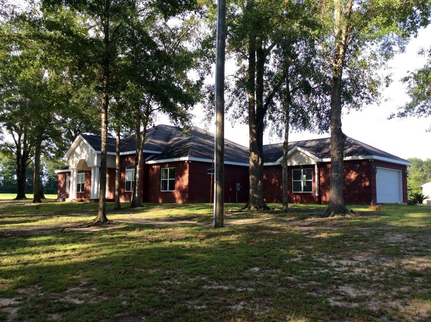 A hidden estate located right in the middle of Baker, part of a 34.75 Acre parcel This Secluded Country estate, affectionately known as the Plainsman Preserve, features a gorgeous 3258 Sqft Custom home on 9.43 +/-acres of pristine land! See MLS 733093 for full parcel. This is that rare find you've been looking for... beautiful land offering privacy and seclusion with a High quality home built to high construction standards. The property is amazing! As you enter the gate and pass the canopy tree lined entry, you'll feel like you are in paradise! The property opens to an expansive clearing with the beautiful home in the center. The property is suitable for farming, horses, livestock, or virtually any use you could imagine. Whether you want a working farm/ranch,or you just want a fine home