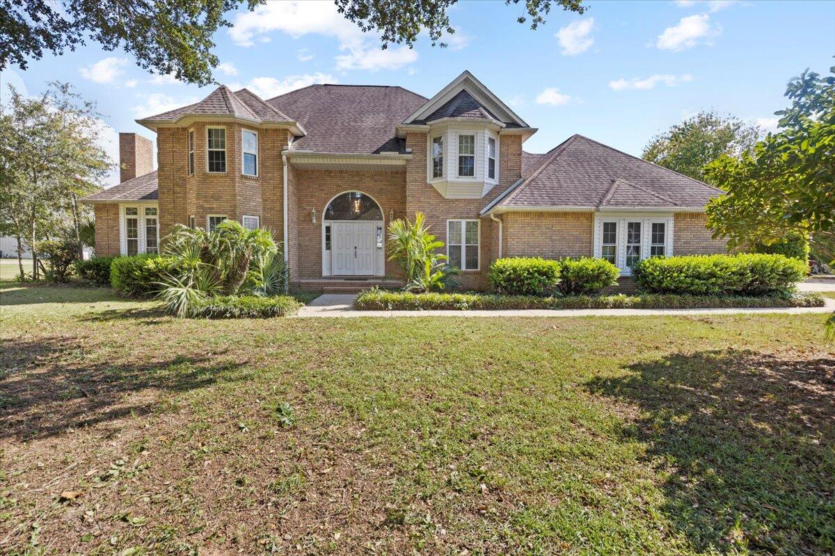 Extraordinary opportunity! This 1-acre property features a 5BR, 2.5BA two-story brick home and a massive 56'x60' hangar (2023) with 46'x15' door, 14'x14' RV door, and direct access to the HOA maintained grass Airstrip, perfect for aircraft, RVs, boats, cars, or workshop. Imagine flying to or from work! Step inside to a beautiful staircase, high-ceiling great room w/ hearth fireplace, family room, breakfast nook, dining, laundry, half bath, and 1 BR. Gorgeous kitchen with stainless appliances, quartz counters, island, herringbone tile & new light fixtures. Renovated baths, new LVP throughout. Upstairs: spacious primary suite w/ freestanding tub & shower + 3 BRs & full bath. Outdoor covered patio/grill area, plant bed for garden lovers & shed.