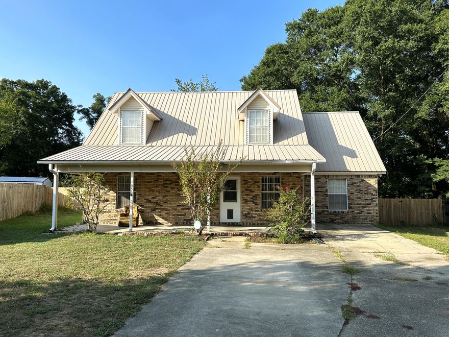 Charming, north Crestview home that has been 'much loved' and well maintained by its only owners. There's so much potential to make it your own, or just move in as it is and it's ready to go. The Primary suite, guest bath, family room and formal living room make up the first floor and there are 2 bedrooms and a full bathroom upstairs. The staircase is wide, and the steps are perfectly spaced for ease going up and down. The spacious, enclosed porch is equipped with a nice hot tub and the privacy fence was just recently replaced. The hot water heater and HVAC are relatively new. There is a storage building  for all of your lawn and garden tools and a covered patio beside the enclosed porch. You can enjoy nice evenings on the front porch, back porch or patio! Come see this cute home today!