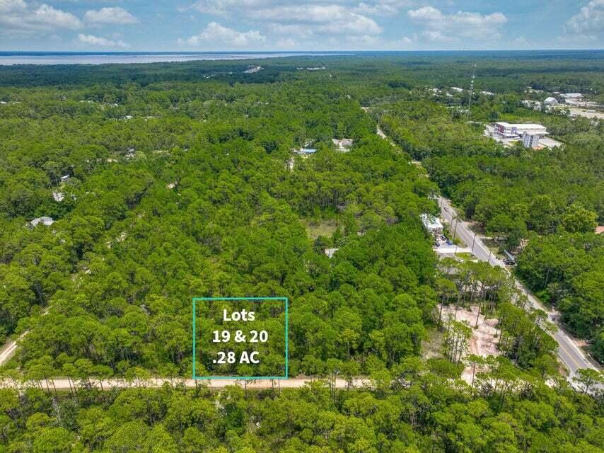 If you're looking for privacy, nature, and proximity to the water, this lot has it all. Tucked away just 2 miles north of Hwy 98, this .29-acre property offers a peaceful setting while still being conveniently close to everything Santa Rosa Beach has to offer. You're less than 4 miles from Ed Walline Beach Access and Topsail Hill Preserve State Park, and only about a mile from Cessna Landing, a county park on the bay with a boat launch, fishing, picnic areas, playground, and more. Plus, you're just minutes from grocery stores, restaurants, and local shops. Need more space? The neighboring lots (17 & 18) are also available, giving you the opportunity to own a combined half-acre to build your ideal coastal retreat. Contact us today for details!