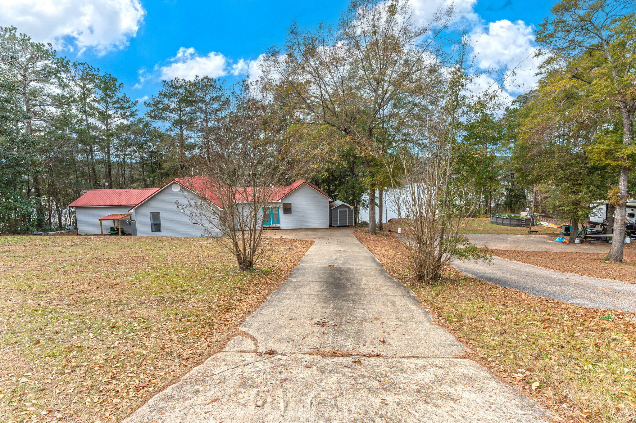 Discover Lakefront living at its finest in this 4/3 home on Gantt Lake. The 2,487 square foot home perfectly captures waterfront charm while offering all the modern comforts you need. A stunning full-length deck spans the back of the house, connecting to a thoughtfully designed boardwalk that leads to a serene gazebo. Keep going, and you'll find the cherry on top - a party room perched right over the water, complete with boat docks. Whether you're grilling with friends, sipping morning coffee on deck, or hosting gatherings in the over-water party room, home is designed for those who love to entertain and enjoy lake life. It offers the perfect balance of peaceful waterfront living while keeping you connected to community amenities. Bring belongings and start living your lake home dreams!