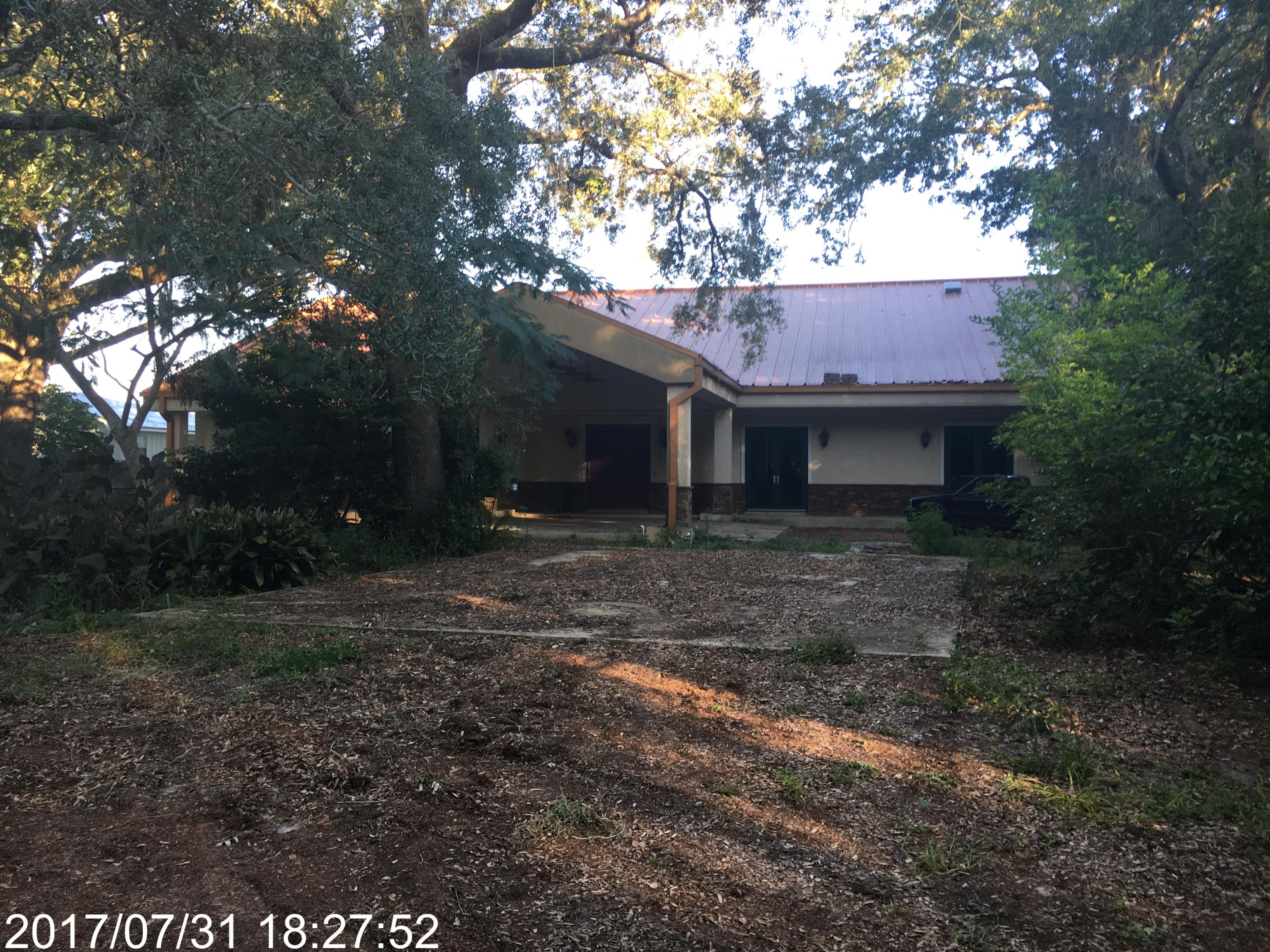 REO. List price: $649,900.00. See Auction.com for details. Unique custom built home tucked back on .75 acres with approximately 100 feet of deeded water access on beautiful Choctawhatchee Bay. You enter this home's grand foyer and are greeted with cathedral ceilings, a floor to ceiling stone fireplace, sweeping views of the bay and a custom chef's kitchen. Custom flooring, upgraded lighting features, walk-in wine and bar pantry, custom kitchen cabinetry, plus more and more. Master bedroom has a beautiful focal fireplace as well as his and her luxurious separate baths. Large walk-in pantry, built-in desk. Too many custom upgrades to list. No value given to out building. As-Is. Bank of America, NA employees, household members and HTS business partners of the bank are prohibited from purchasing this property, whether directly or indirectly
