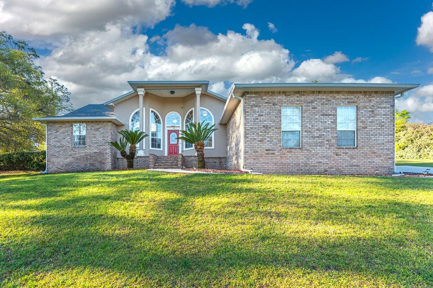 Welcome home to this  exquisite 3 BR/2BA property located on a one acre corner lot. If you have been searching for  a place to relax and spend quality time with family and friends, this is it!  You are greeted by massive arched windows on the front of the home that accommodate 12' ceilings in the formal dining room and office area.  The living room showcases a vaulted ceiling with plant ledges and a corner gas fireplace with authentic marble tile surround. The  kitchen features white cabinetry, granite countertops, and newly replaced stainless steel dishwasher, gas stove and refrigerator.  Located just off the kitchen, the master suite offers  cultured marble double vanities, a spacious jetted