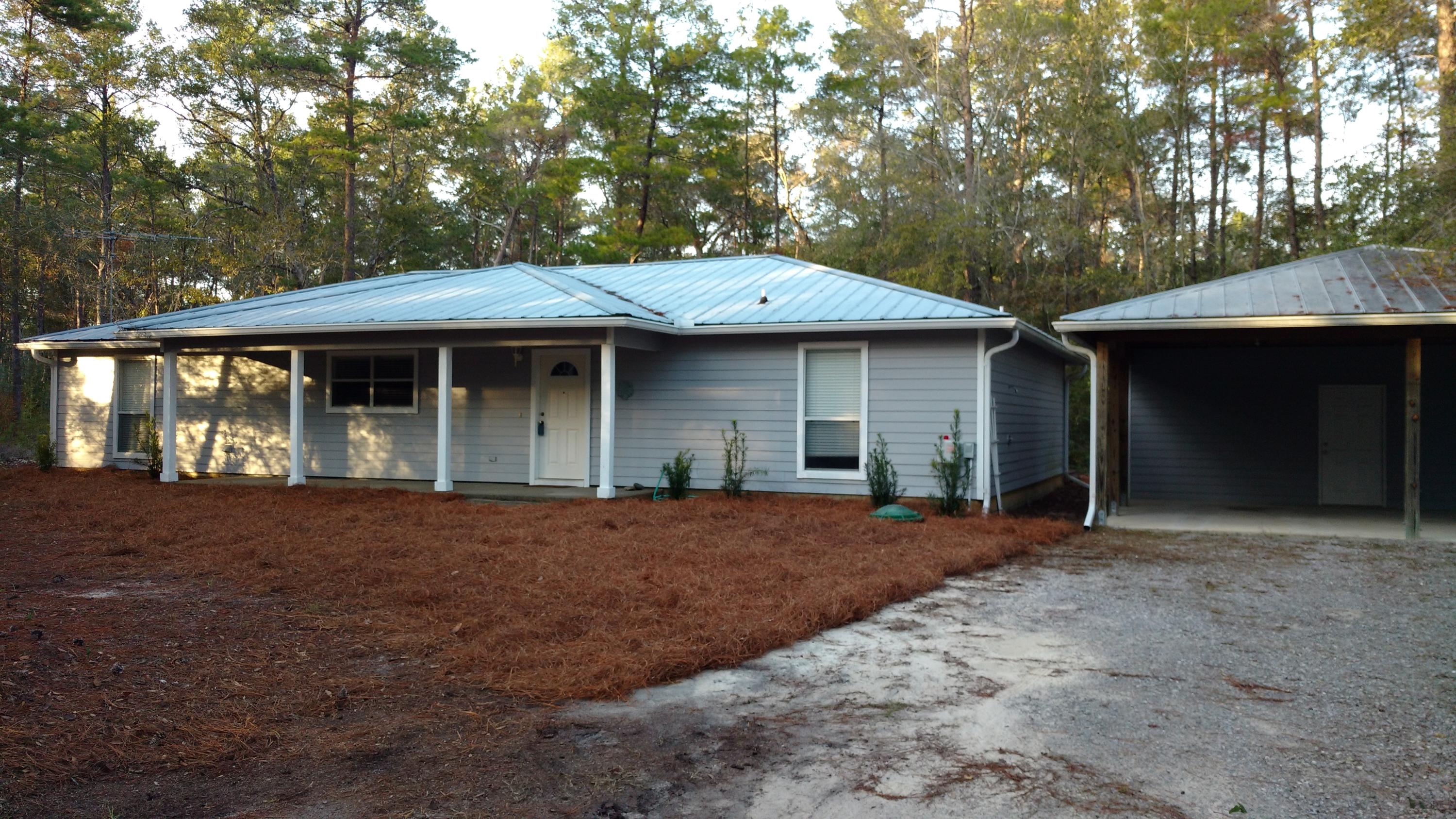 Historic Point Washington. Eden Estates Subdivision, close to school, State Park and 10 minutes to the Beach. A chance to buy an affordable home on a half acre of land with lots of trees in Point Washington. This three bedroom, one level has a large kitchen overlooking a large family room area. Split bedrooms, two and half baths, wonderful Florida Room and so much more possibilities in this home. A two car carport with extra storage.