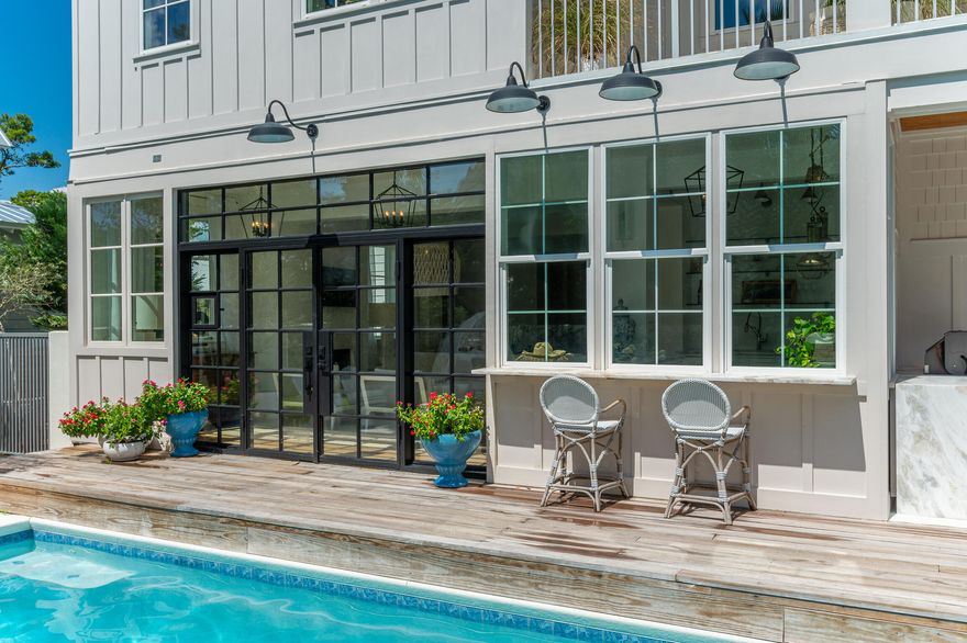 This is the best of Florida coastal living! Three-story LEED certified Home is built with a whole house generator and solar panels, AND the 'GOLD STANDARD' of materials, CONCRETE!!! ! A rare location with dual views of the  Emerald Gulf waters and Draper Lake. Inside the Walled gardens, enjoy afternoons lounging by the pool and evenings roasting marshmallows over the firepit! Luxurious interior provides the convenience of two full kitchens, timeless new marble bathrooms, custom bunk-room and a 360 views from the look-out tower..... perfect for sunrise and sunsets!  Conveniences like a Scotsman ice maker, freezer drawers,  and a 3 car garage ensure  your comfort and  peace of mind! Seller is now offering for annual rental. Contact Arlo. Monthly rent offering  $20,000.