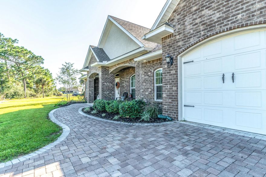 Custom Samuel Stevens home designed with elegance and class down to each intricate detail. Newer gunite pool for relaxation. Wood tile flooring throughout the main area with a brick entry wall from the foyer. The open kitchen has beautiful upgraded granite and all wood cabinetry with a double stainless steel oven and flat cook top as well as a remarkable travertine backsplash. The master retreat completes the home with an enormous 21x15 bedroom and a custom WIC to match. Walk in shower with rain-head and a separate garden tub w/ upgraded tile. 12 foot trey ceilings, recessed lighting, extensive crown molding, window casings, and cased columns leading into the dining area. Extras: Mudroom area, wood kick-splash installed, paver driveway, & golf course views. Cul-de-sac home corner lot