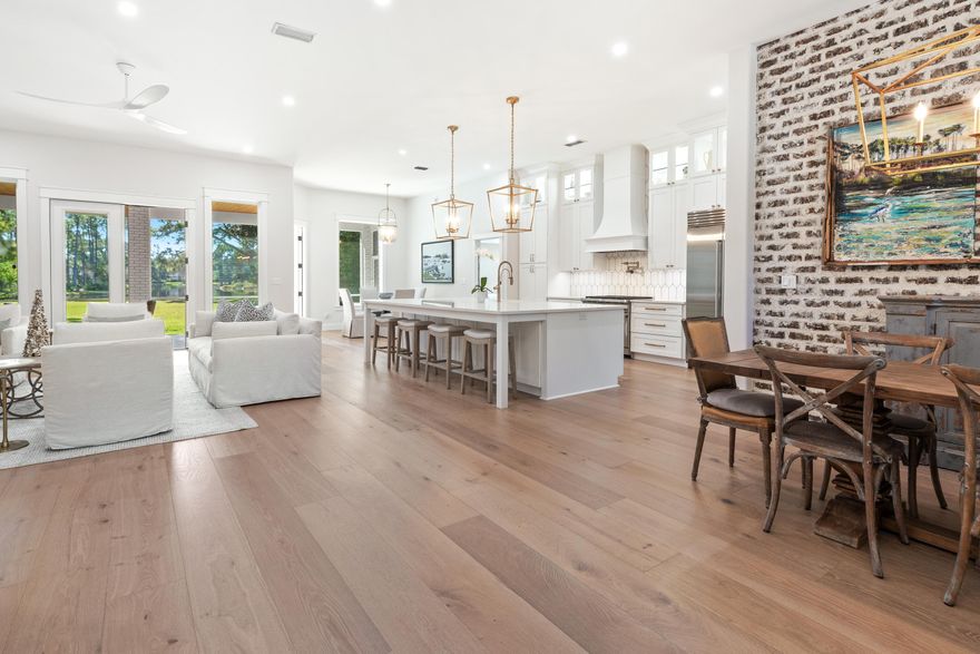 Welcome to 228 Matties Way, an exquisite lakefront retreat that perfectly balances timeless elegance with modern sophistication.Completely renovated from 2023 to 2025, this stunning home showcases exceptional craftsmanship, designer finishes, and sweeping views of Lake Rangia. Every detail has been thoughtfully curated to create a residence that is both beautiful and highly functional.Step inside to an inviting open-concept interior where luxury and comfort meet -The designer kitchen has been totally transformed with custom cabinetry, premium quartz countertops, and top-of-the-line Sub-Zero, Cove, and Wolf appliances. Undermount lighting and a custom tile backsplash add both warmth and sophistication. In the living area, a new wood-burning fireplace with a custom cypress mantle and quartz-topped built-ins creates a cozy yet refined focal point, while the adjoining dining room features a brick accent wall that ties seamlessly into the home's design.

The fully renovated bathrooms, including the master, Jack & Jill, and guest baths, feature high-end finishes and elegant detailing throughout.  A custom "Her's" master closet provides a beautifully organized space with fully customized storage solutions.

Throughout the home, you'll find new flooring, recessed lighting, designer fixtures, custom interior shutters, and solid two-panel doors with premium hardware. Every doorway, window, and baseboard has been finished with elegant, stacked header trim, and the entire interior - including ceilings, walls, and trim - has been freshly painted. A new Trane 5-ton HVAC system ensures year-round comfort and energy efficiency.

The exterior has been equally transformed with every element upgraded for beauty, durability, and peace of mind -

All windows and doors have been replaced with hurricane-impact-rated models, complemented by hurricane-rated garage doors and a new roof installed in August 2021.

The screened back porch, finished with a pine tongue-and-groove ceiling and stone tile flooring, offers the perfect place to relax while enjoying tranquil lake views.

A new paver driveway, upgraded exterior lighting, and a rebuilt irrigation system complete the thoughtful exterior enhancements. 

Set on one of the most desirable lots in Kelly Plantation, this property offers breathtaking views of Lake Rangia, a deep manicured backyard, and the serene beauty of the bird sanctuary beyond your porch. Best of all, it sits in Flood Zone X, so no flood insurance is required.

Located within the exclusive gated community of Kelly Plantation, residents enjoy world-class amenities including a meticulously maintained championship golf course, golf clubhouse with bar and grill, ballroom, and restaurant.

A separate Owner's Club offers spaces for meetings and events with both large and small rooms, full kitchen facilities, and a state-of-the-art fitness center.

Outdoor recreation abounds with tennis, pickleball, and basketball courts, scenic nature trails, a dog park, and an equestrian center.

Just a short golf cart ride away are Destin's iconic sugar-white beaches, along with the area's finest dining, boutique shopping, championship golf, and world-class fishing.

With every major system, finish, and detail recently updated, 228 Matties Way is truly move-in ready. This home embodies the perfect blend of luxury, functionality, and natural beauty - all in a serene and private lakefront setting within one of Destin's most sought-after communities.