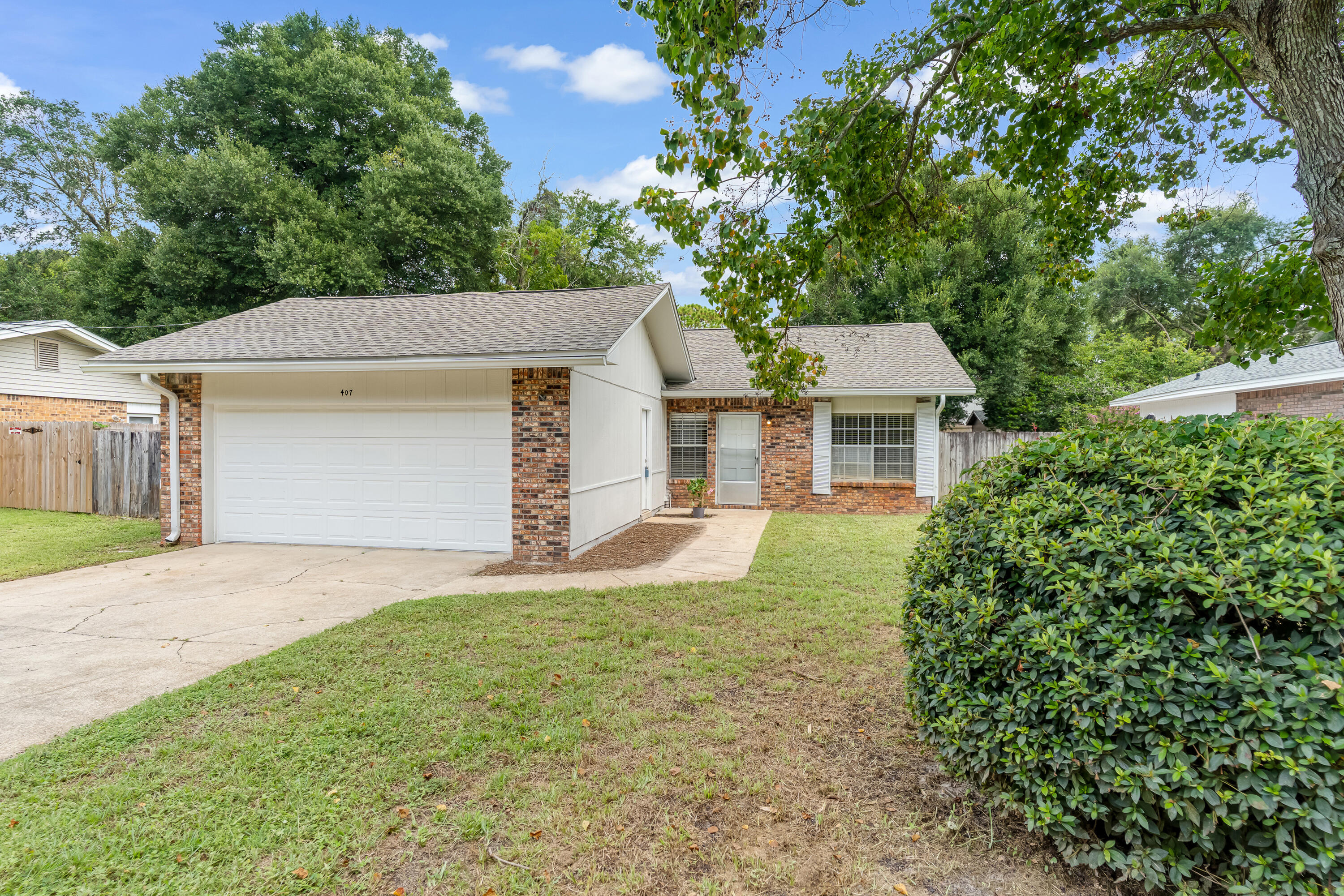 This house says, ''RETIRE to Sunny Florida'' and ''MAKE ME your FIRST HOME''. Perfect size home with 3 bedrooms and 2 baths, an open kitchen and good size living room and dining area. A nice covered patio takes you outside where you will find a storage shed for tools and fenced back yard. The central location could not be better, with easy access to schools, dining, medical facilities and both Eglin AFB and Hurlburt Field. PLUS the beach and Gulf of America about 15 minutes drive. NEW SPARKLING STAINLESS APPLIANCES and KITCHEN MAKE-OVER 2025. ROOF and HVAC replaced 2021, bathroom shower tub resurfaced 2021, sprinkler pump new 2019, fence replaced 2019, some fresh paint 2024 and new garage door 2023; less maintenance for a new buyer.