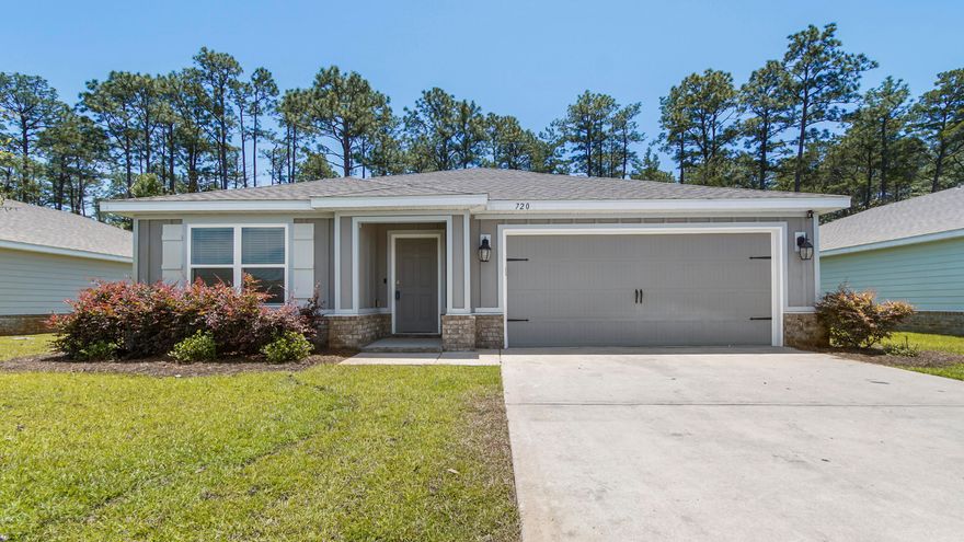 Welcome to 720 Riverwalk Circle, a beautifully designed 4-bedroom, 2-bathroom home built in 2022 located in the sought-after Riverwalk community in Freeport, Florida. Offering 2,122 square feet of living space, this home features a spacious open-concept layout with tall ceilings and luxury vinyl plank flooring and carpet throughout the main living areas. The modern kitchen is equipped with stainless steel appliances, formica countertops, new carpet, and elegant painted cabinetry--perfect for both everyday living and entertaining. The master suite includes a generous walk-in closet and a private en-suite bathroom with a double vanity. With two separate living areas and sliding glass doors that open to a peaceful patio with wooded views, this home provides both comfort and functionality. Residents of Riverwalk enjoy a wealth of amenities, including a swimming pool, a well-appointed clubhouse with an exercise room and gathering space, and a community dock with access to Four Mile Creek and the Choctawhatchee Bay. 

Located just minutes from downtown Freeport's shopping and dining options, and a short drive to the stunning beaches of South Walton, 720 Riverwalk Circle offers the perfect blend of small-town charm and coastal living. Seller is offering $8,000 towards Buyers Closing Costs and Prepaids with Acceptable Offer. Call today and make this home yours! 