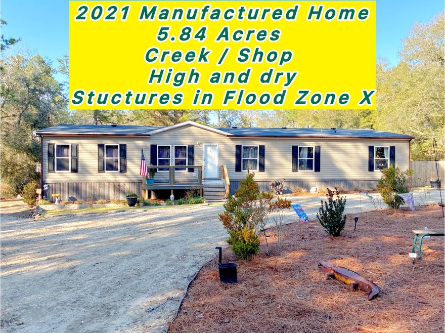 HIGH & DRY / Flood Zone X / Zillow's Flood Zone Info below is INCORRECT. Secluded paradise at the end of a private, gated, crushed concrete drive, where 5.84 ac. of Florida wilderness meets a meticulously maintained homestead designed for true self-sufficiency. This is more than a home; it's a private ecosystem featuring fruit trees and 1,261' of a KINGS LAKE FED CLEAR CREEK. The creek and orchard are a homesteader's dream. There's a massive variety of mature fruit and nut trees including Asian Plum, Guava, Fig, Peach, Cherry, Pear, Citrus, and more. Complemented by raised garden beds, a greenhouse, and a pro composting system plus extras. Features maintained ATV riding trails with jumps & mini golf. $10k Culligan water filtration. Large, powered shop / studio. Perm. Attached MH. Must see Welcome to 507 Stewart Drive
The Ultimate Private Creek-Front Estate
Introduction: A Rare Opportunity in DeFuniak Springs
Are you searching for the perfect balance of modern comfort and rugged outdoor freedom? Welcome to 507 Stewart Drive, a stunning 5-bedroom, 3-bathroom residence nestled on 5.84 pristine acres in the highly coveted Kings Lake area. Built in 2021, this spacious manufactured home still boasts that "new home" feel, offering plenty of room to spread out without a neighbor in sight. Whether you are an avid gardener, a hunting enthusiast, or an ATV rider, this property is designed for those who value privacy and the great outdoors.

The Entrance: Seclusion Meets Curb Appeal
From the moment you arrive, you'll notice the natural green buffer and secure double-gated fence line providing total peace of mind. The approach is as functional as it is beautiful; the owners invested $8,000 in a premium crushed concrete driveway, ensuring your vehicles stay clean while maintaining the rustic elegance of a country estate.

Hobbyist's Paradise: Workshop, Greenhouse, & Entertainment
This property is a dream for the "do-it-yourself" enthusiast. Highlights include:
" Powered Workshop/Studio: A versatile space ready for your hobbies, or easily convertible into additional living quarters.
" Gardener's Dream: Includes a dedicated greenhouse, raised garden beds, and hundreds of dollars in high-quality planters to       jumpstart your botanical oasis.
" Outdoor Living: Relax on the expansive multi-level back deck overlooking a custom-landscaped mini-golf green.
" Family Fun: Custom oversized steppingstones lead the way to a large children's playhouse (which can stay or be removed at the buyer's request).

Adventure at Your Doorstep: ATV Trails & The Creek
For the thrill-seekers, the backyard features professionally landscaped ATV trails, complete with wide roads and two custom jumps.
The crown jewel of the estate, however, is the 1,261 feet of clear, lake-fed creek winding through the property. The owners have cleared two private trail access points leading down to the water's edge. There, you'll find a charming elevated tiny house--the ultimate off-grid retreat--perfect for creek-side camping or enjoying the solar-powered ambiance at night.
A Natural Wildlife Corridor
Located near the expansive Kings Lake, this property acts as a "natural highway" for Florida's local fauna. Because hunting hasn't been permitted on-site, the wildlife is incredibly peaceful. It is common to see deer grazing in the backyard even while you're outside. The owners have frequently spotted:
" Deer & Fox
" Bobcats (The Florida Lynx)
" Coyotes

Pure Luxury: The Water System
Forget the typical issues associated with rural living. This home features a deep well equipped with a $10,000 Culligan Water Filtration system. You will enjoy bottled-water quality from every tap, free of iron deposits or odors. From the taste of your morning coffee to the luxury of a soft-water shower, this system provides a level of pampering rarely found in a country setting.
________________________________________

507 Stewart Drive isn't just a house; it's a lifestyle. Come experience the seclusion, the wildlife, and the endless possibilities of this DeFuniak Springs gem.

