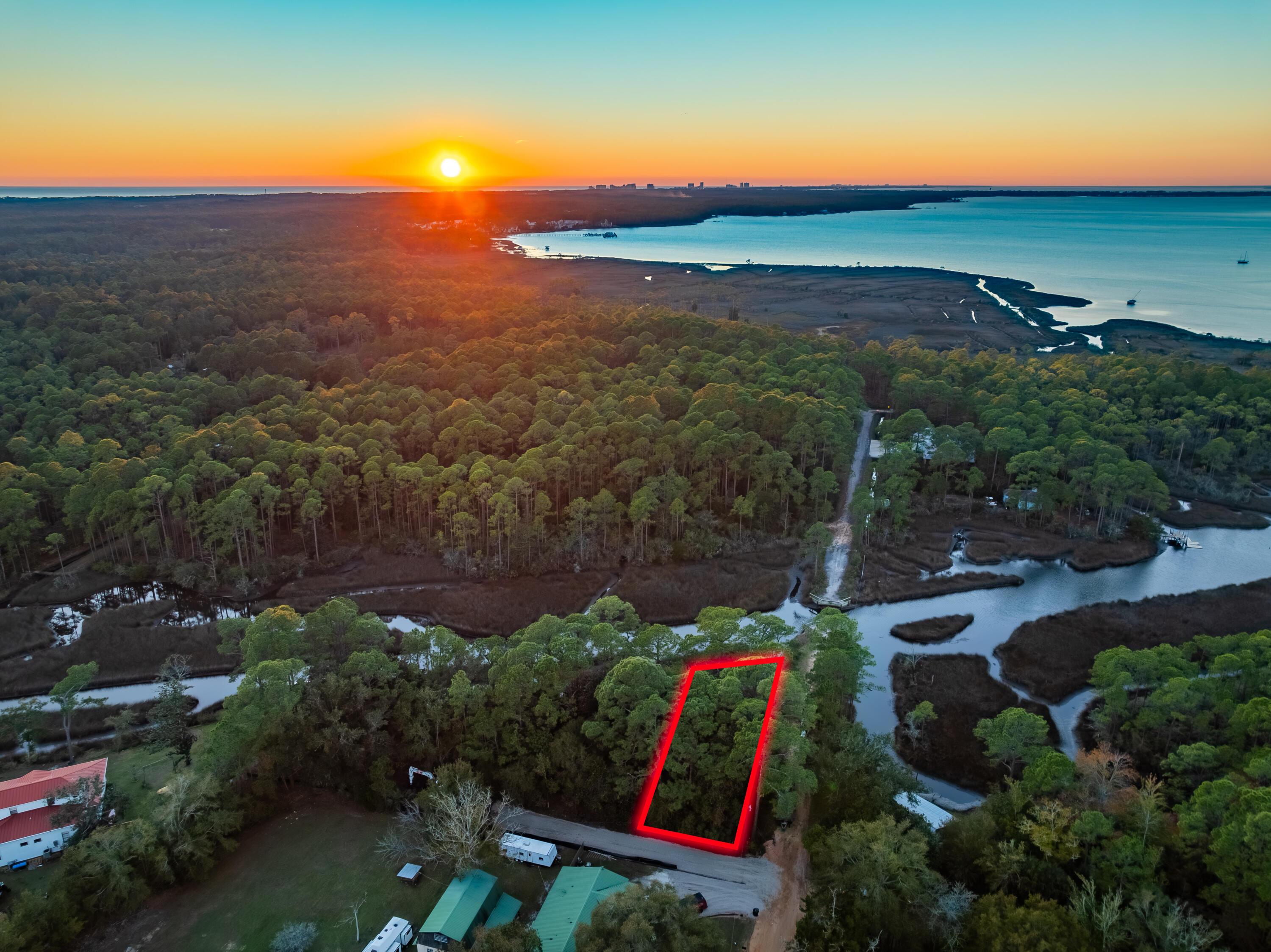 An exceptional waterfront property in Santa Rosa Beach is now available. This western-facing lot offers stunning panoramic views of Hogtown Bayou, paired with deep-water access that makes it a true haven for boaters.Located just moments from Cessna Landing, this lot provides easy access to the beaches and the vibrant lifestyle of 30A's west end, including Gulf Place, Shunk Gulley, and other local favorites. Whether you're looking to build your dream home or secure a prime investment, this property delivers on location and lifestyle.Key features include:Unmatched Hogtown Bayou viewsDeep-water access for boating enthusiastsUtilities available: water, sewer, and electricClose proximity to beaches, dining, and shopping Create your own piece of paradise and enjoy the best of waterfront living in Santa Rosa Beach. Survey available upon request.