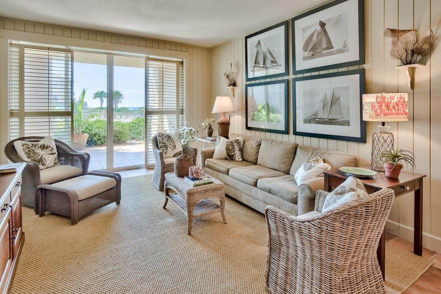 INTERIOR DESIGNER'S PERSONAL DREAM BEACH HOME.  Featured in Coastal Living Magazine, one of Birmingham's top designers brought her creativity to the beach to create an elegant yet warm home. It's nothing like the ''typical'' beach condo, but a rare retreat within a private community. No detail was overlooked.  Every wall is tongue and groove wood...no sheetrock. Custom floor plan, custom cabinets, custom wood countertops, custom built-in kitchen cupboards, custom built-in bookcases in the living area...every feature was personally selected which gives the home it's unique charm and character. The oversized balcony opens onto a lawn allowing for family gatherings...a rare feature for any condo at the beach.  Indoor, conditioned storage completes this home. Call to schedule your private tour