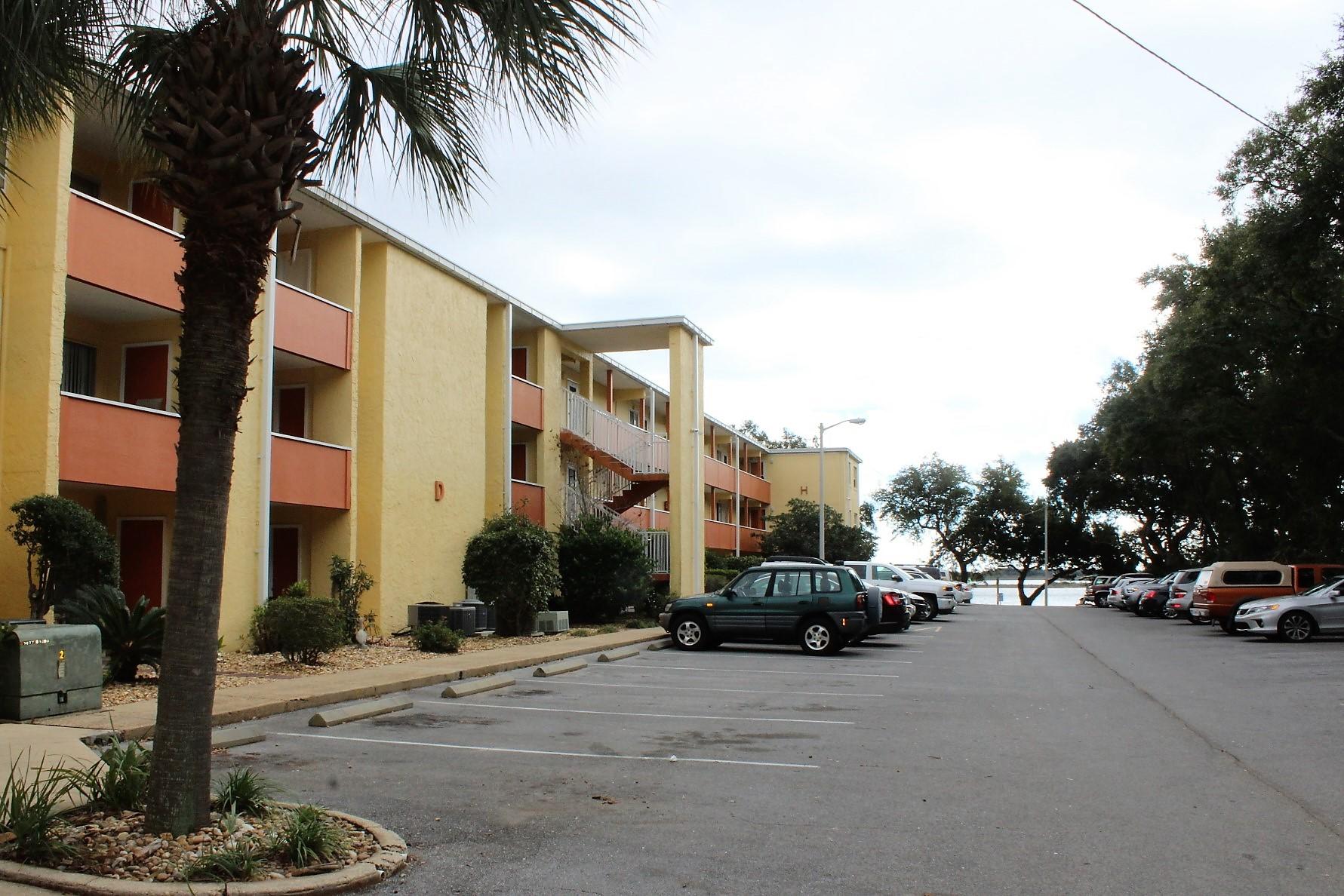 REDUCED TO SELL..Adorable & Affordable condo located in a waterfront complex on sound. Centrally located to Hurlburt Field base, shopping, restaurants & schools. Kitchen has smooth top stove, dishwasher, refrigerator, pantry and double stainless sinks. Upgrades include wood floors, stand in shower, marble bath counter, windows and sliding back doors with blind insert leading to patio. Covered Patio with ceramic tile floors and outdoor (owners) storage off patio. The complex has a waterfront pool, majestic courtyard, club house, laundry facilities & plenty of parking. Enjoy the spectacular view of the sound on the dock! Fish on the dock! There is a kayak & paddle board storage area by the water for easy access to launch. Easy Florida living on the water! Don't miss this home!