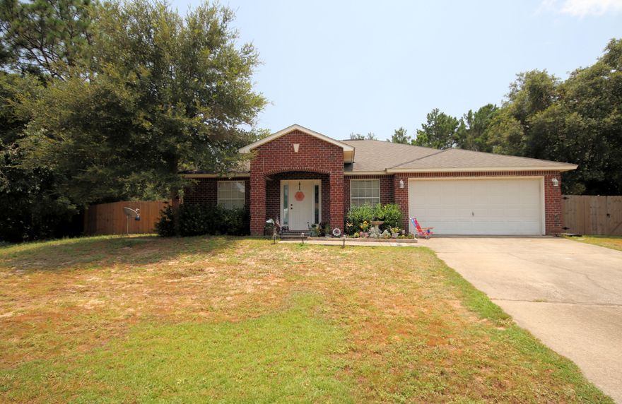 In the Center of Navarre and 5 Min to the Beach!! This Home Sits on Almost a Half Acre of Land. Only A Small Portion of the Back Yard has Been Cleared. There is Plenty of Room to Add a Pool! You Enter the Front Into a Formal Living Area on Your Left and Formal Dining on Your Right. Note the LVP Flooring Throughout the Common Areas With Tile in the Kitchen and Bathrooms. The Kitchen Opens to the Family Room. The Master Bedroom is to the Right off of the Great Room with the Additional Bedrooms to the Left. Buyer to verify all measurements and pertinent information.