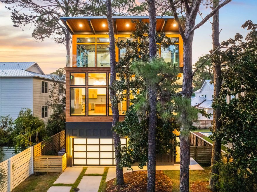 Set aside the Gulf of Mexico and one of 30A's rare coastal dune lakes, this newly constructed modern retreat offers a combination of water views and design details that's seldom found along 30A. Thoughtfully designed across three levels, this four-bedroom home features a private pool, expansive balconies with Ipe decking, and a first-floor lockout suite with its own kitchenette complete with an oven, dishwasher, microwave, and refrigerator, making it ideal for guests or short-term rental flexibility.Inside, the home showcases soaring ceilings, a beamed ceiling in the main living area, and an open-concept kitchen outfitted with quartz countertops, a large island, and premium appliances. Oversized Anderson windows flood the interior with natural light while framing the coastal surroundings. A Eurowall folding door on the first floor seamlessly opens the indoor living area to the outdoor pool deck, creating an exceptional entertaining space.

The master suite is designed as a true retreat, featuring a sitting area with Gulf views, a wet bar, a large walk-in closet with its own washer and dryer, and a luxurious spa-like bathroom. The master bath includes a spacious tiled shower with dual rainfall shower heads, frameless glass doors, and even Gulf views from the shower itself, delivering a true resort-style experience.

The private pool is currently under construction and scheduled for completion very soon, allowing the future owner to enjoy the full outdoor living experience. The pool area will feature a Peacock paver deck, lush landscaping, and direct exterior access from the first-floor suite, perfect for hosting guests or creating a separate rental opportunity.

The home also includes a large two-car garage that is air-conditioned and plumbed for a utility sink, though not counted in the total heated and cooled square footage. You will also find laundry conveniently located on all three floors.

Situated just minutes from two nearby beach access points, West Allen Loop and Lake Causeway, the location offers quick access to the sand and surf, along with close proximity to some of 30A's most beloved local spots. Enjoy fresh Gulf seafood and live music at Stinky's Fish Camp, or grab a cold drink and watch the sunset from Shunk Gulley Oyster Bar. Whether you're relaxing poolside, entertaining guests, or heading out for a beach day followed by dinner nearby, 129 Oyster Lake Drive delivers a lifestyle that captures the very best of new construction living on 30A


