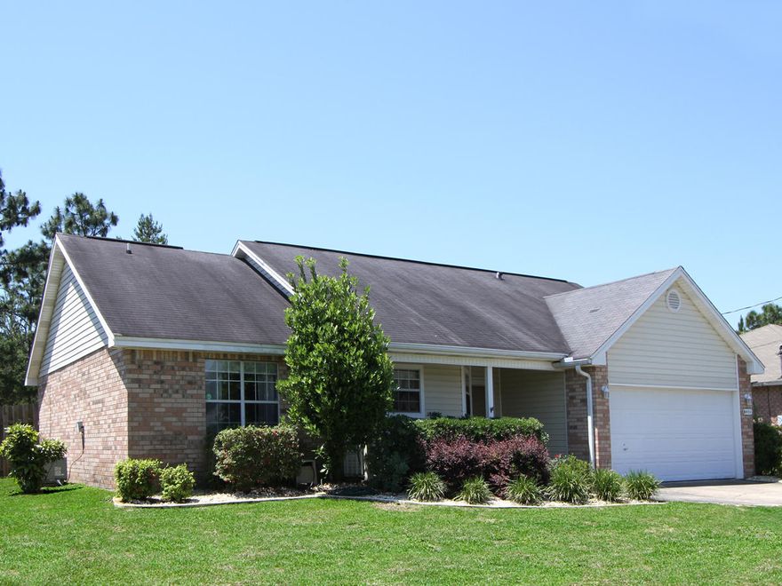 Beautiful, well maintained home in the highly sought after Holley by the Sea subdivision! This home has numerous upgrades and amenities to offer! The kitchen has beautiful granite counter tops, stainless steel appliances, tile flooring, a large kitchen island, and custom cabinets! The kitchen also features 2 ''look/pass through'' windows into the living area which also give a more open feel. This property offers an split and open concept floor plan with a great flow. There is a large family room which is wired for surround sound, has vaulted ceilings, and a cozy fireplace. The master bedroom has a large walk-in closet. The master bathroom has a double vanity and a garden tub. This property backs up to a thick, wooded area which gives a great deal of privacy. Call for a showing today!