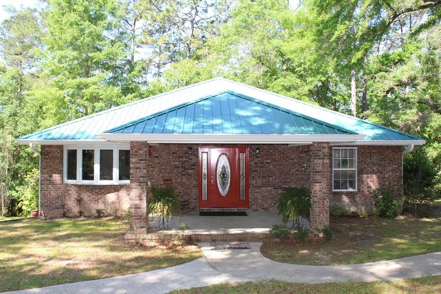 Attention deer hunters, outdoor enthusiasts and nature lovers. Must see this country estate with 22 wooded acres that includes a custom built 3 bedroom 2.5 bath brick home, a 30 x 40 workshop, with office and walk in cooler. Great location! Only 30 minutes to Eglin AFB. Sellers love to hunt! Rolling hills, a creek, green fields, a custom shooting house, deer stands and trails through out the 22 acres making access a breeze! The house is custom designed and built. The floor plan is open and airy. Custom walnut tongue & groove flooring. Gas cook top stove with two electric ovens designed for the serious gourmet cook. Granite counter tops. Chill out on the elevated back deck and watch the deer & turkey roam. shown by appointment. 24 hours notice please