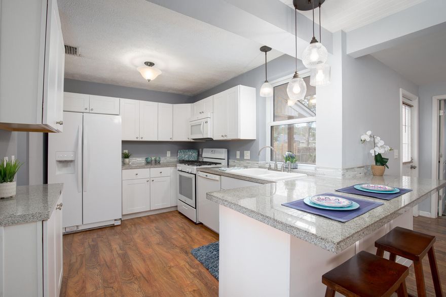 How Cute is This!  4 Bedroom / 2 Full Bath + Bonus Room in Sought After Garnier's Beach Subdivision!  This Classic Florida Cottage underwent a Major Renovation in 2016 to include: Re-Roof /  Copper Re-Wire / Gas Hot Water Heater / Granite Kitchen Counters / Kitchen Cabinets / Bathroom Vanities / Master Custom Tile Shower / Doors / Lighting and Ceiling Fans / Brazilian Teak Laminate Flooring / Tiled Bathrooms.  Other Features include: Double Paned Windows / Large Fenced Back Yard / Gas Stove / 2014 AC and Gas Furnace  / Carport / Covered Front & Back Porches / Indoor Laundry Room / Lawn Pump & Well.  Bonus Room is Large Enough to add a 5th Bedroom.  Located Approx 6 miles from Eglin AFB / 5 miles from Hurlburt Field and only 3 miles to the BEACH!  Located 3 Blocks from Garniers Park...