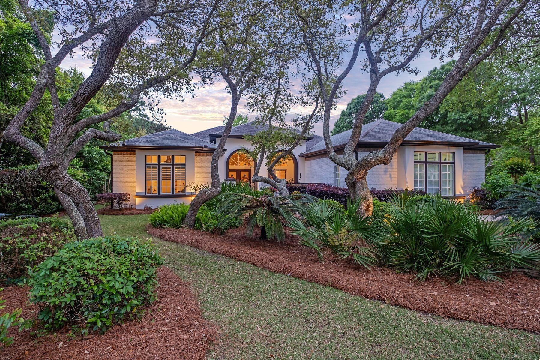 Sitting on a half-acre lot, this charming residence, which was remodeled in 2011, boasts a wealth of outdoor living space that has been carefully landscaped to create a stunning poolside oasis. To the rear, paved terraces and screened patios are sheltered behind high hedges, providing privacy and natural beauty. Head into the screened porch where a fully equipped summer kitchen stands ready for alfresco cooking and dining. This outdoor space is an idyllic place to relax and entertain on a summer evening overlooking the saltwater pool and spa. The gas fireplace makes this a year-round haven for outdoor living! This is a grill master and entertainers paradise! Inside the ten- and 12-foot ceilings and an oversized fireplace lend a cozy focal point.